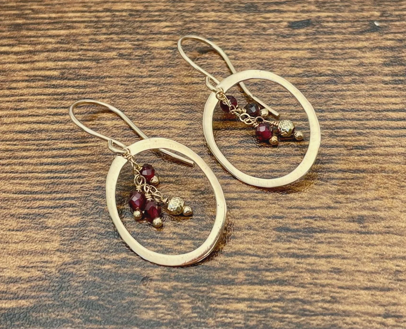 14k gold hoop dangle earrings with garnet gemstones