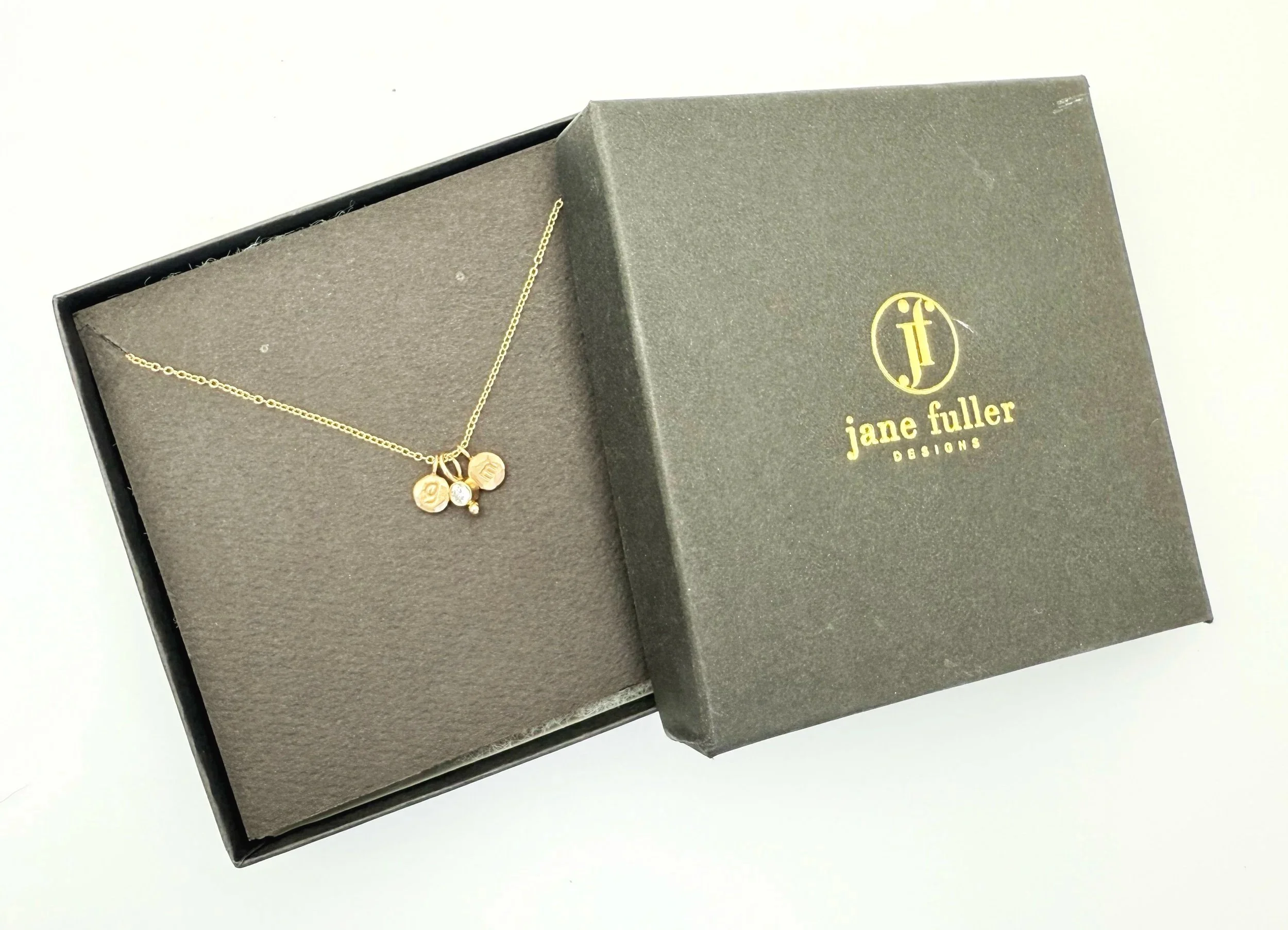 14k gold disc necklace with stamped initials