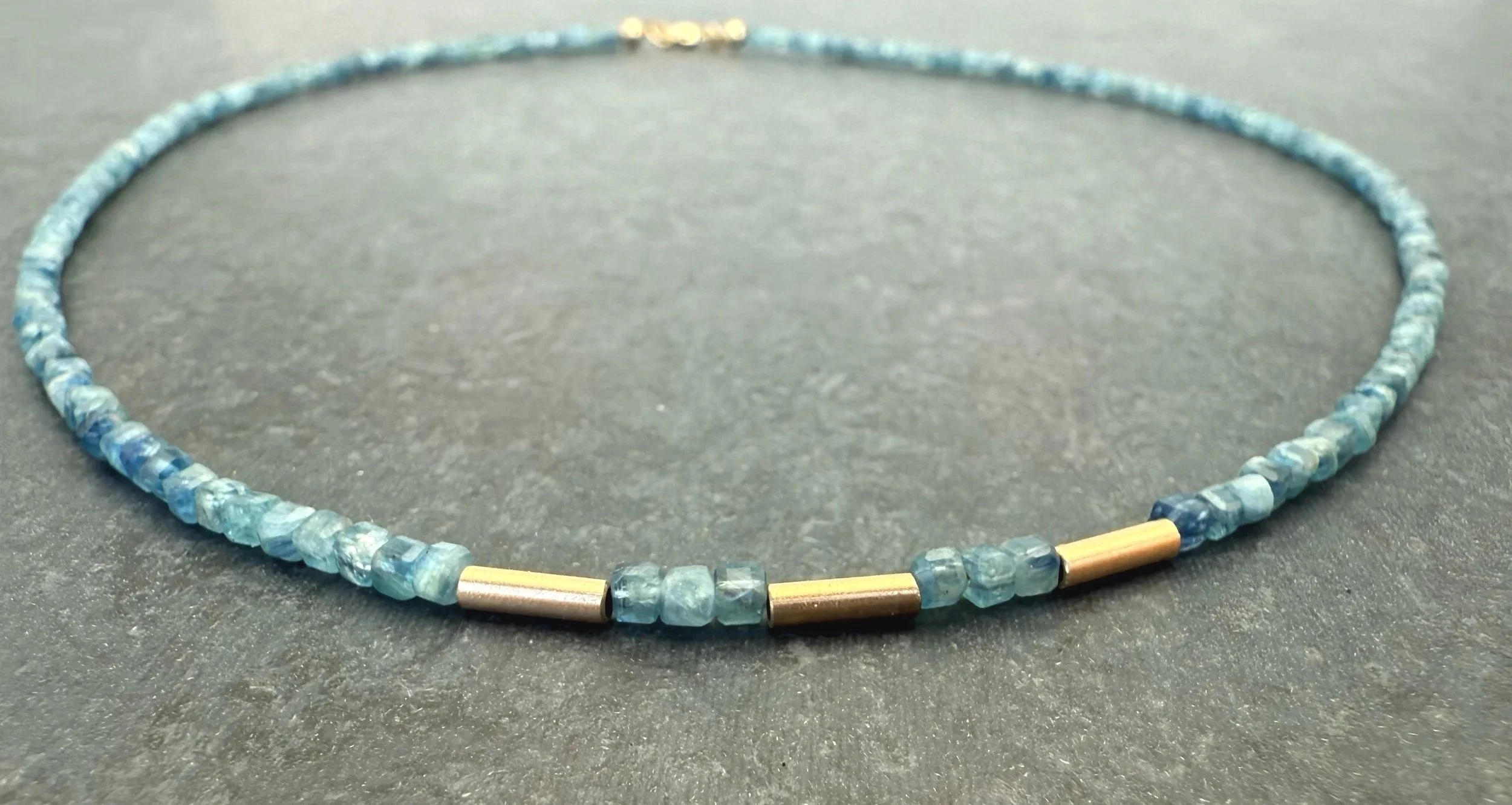 dainty blue gemstone necklace with 14k yellow gold
