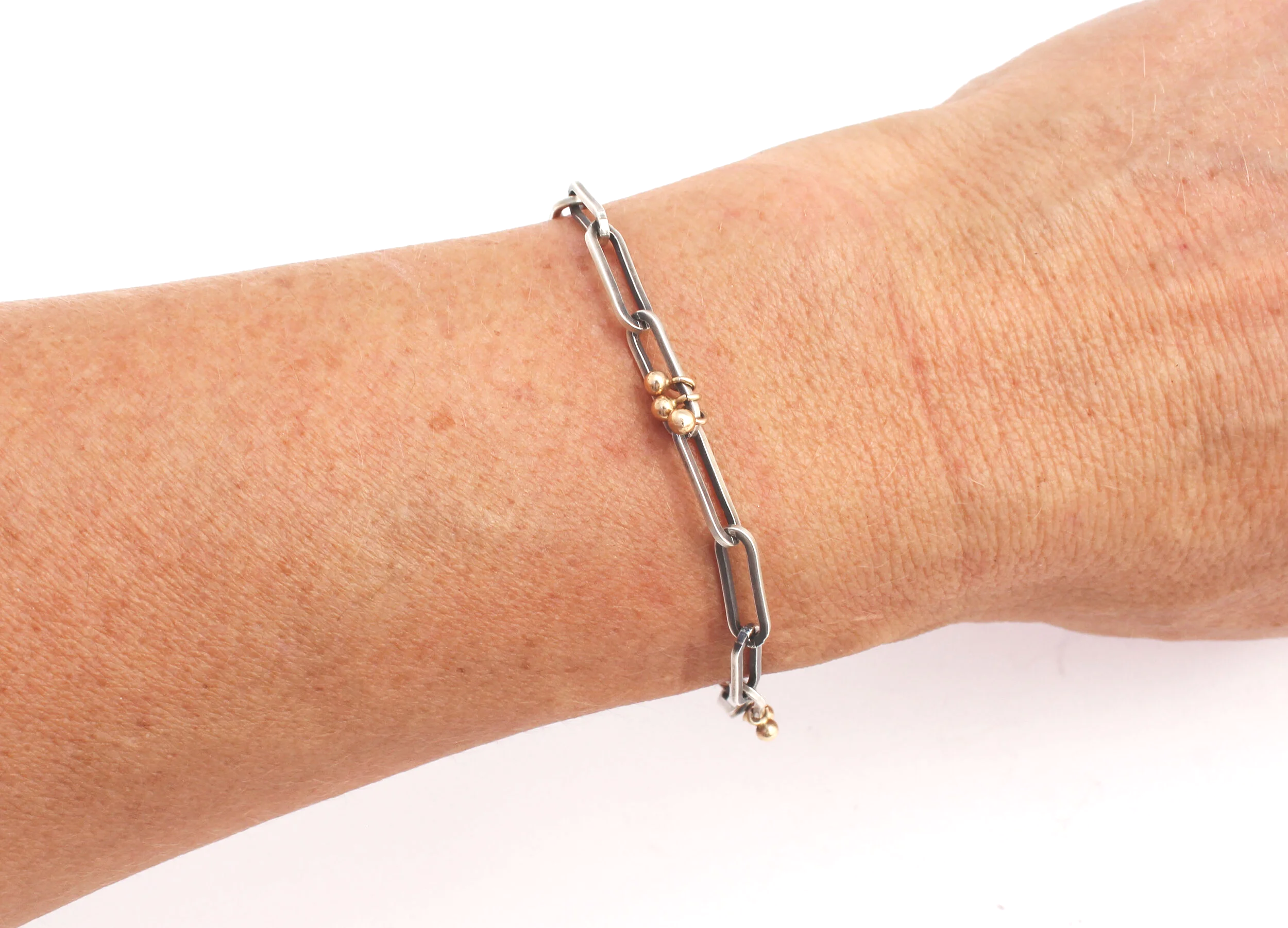 silver and gold chain bracelet
