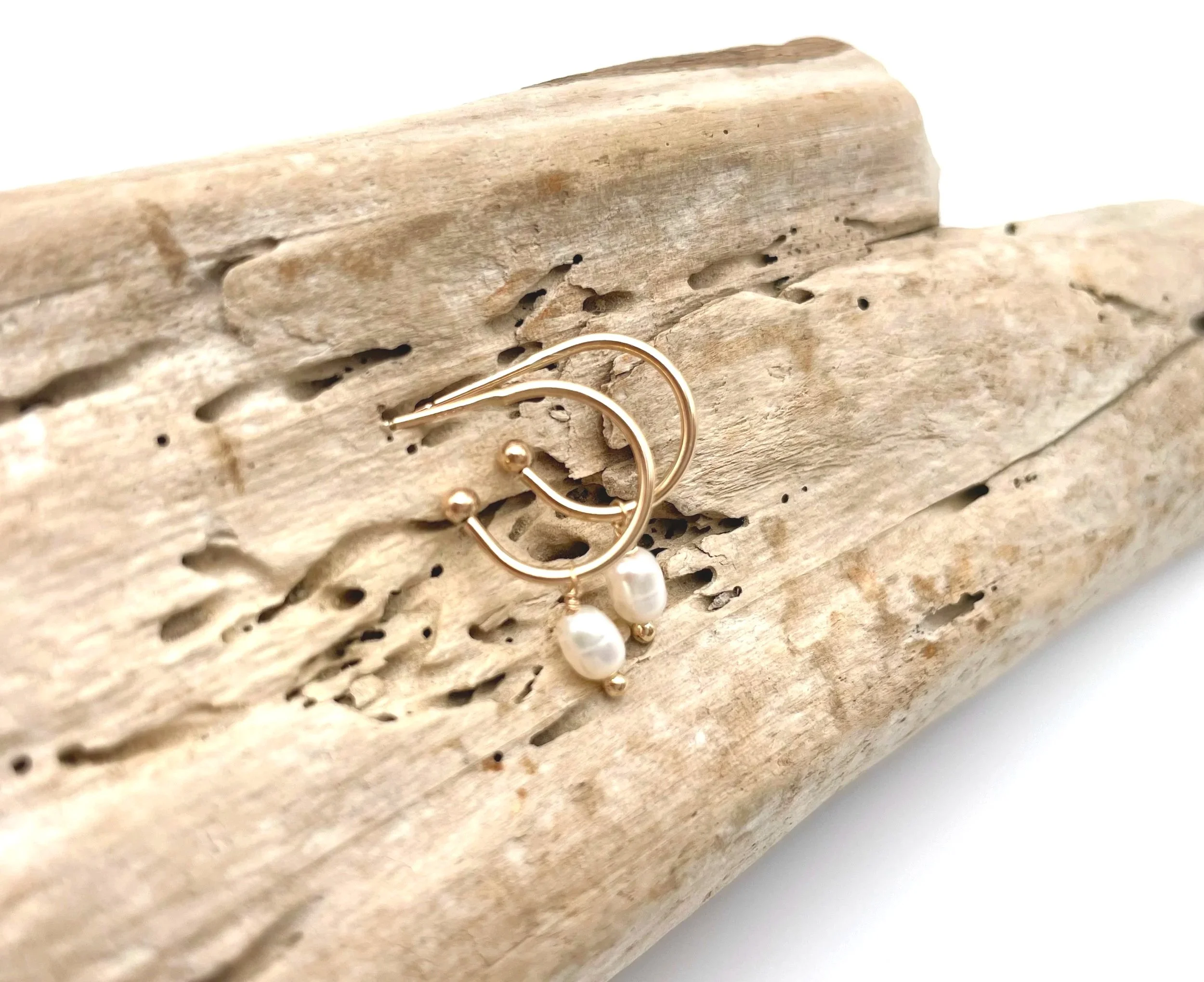 small gold hoop earrings with white pearls
