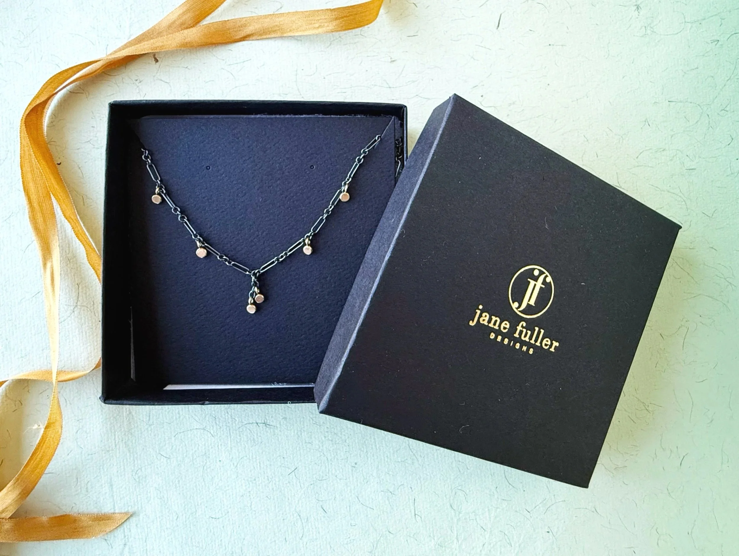 darkened silver chain with 14k solid gold accent dots