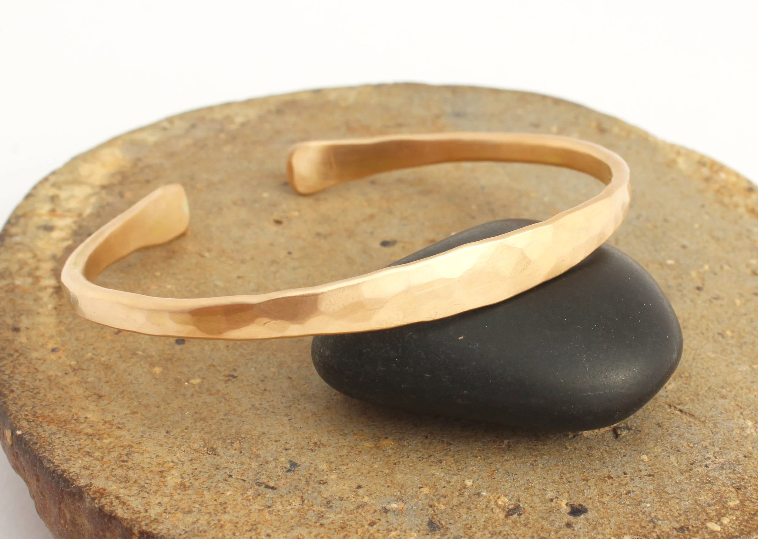 Chunky gold cuff bracelet in 14k gold with hammer texture