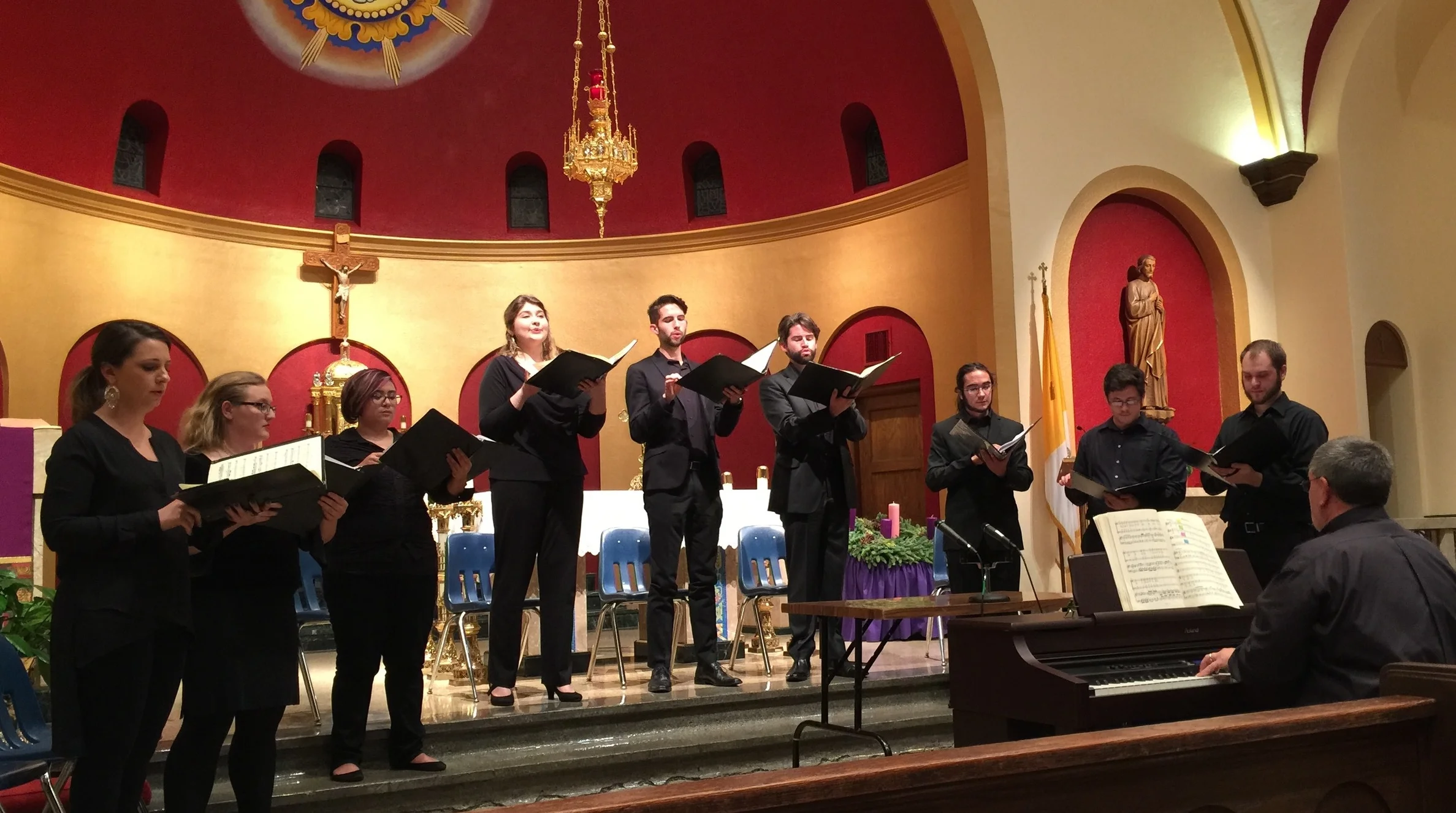 Four soloists and a five-person choir perform Jakub Jan Ryba’s Czech Christmsas Mass in the beautiful sanctuary of St. John Nepomucene Catholic Church in Ennis. Left to right, Julianna Emanski, solo soprano; Amanda Jacobsen, soprano; Francesca Cacal, alto; Hannah Ceniseros, solo alto; Barrett Radziun, solo tenor; Brock Johnson, solo bass-baritone; Santiago Gutierrez Herrera, tenor; Hastings Reeves, bass; Lance Russell, bass; and Dr. Thomas Sovik on keyboard.
Normal
0
false
false
false
EN-US
X-NONE
X-NONE
/* Style Definitions */
table.MsoNormalTable
{mso-style-name:"Table Normal";
mso-tstyle-rowband-size:0;
mso-tstyle-colband-size:0;
mso-style-noshow:yes;
mso-style-priority:99;
mso-style-parent:"";
mso-padding-alt:0in 5.4pt 0in 5.4pt;
mso-para-margin-top:0in;
mso-para-margin-right:0in;
mso-para-margin-bottom:8.0pt;
mso-para-margin-left:0in;
line-height:107%;
mso-pagination:widow-orphan;
font-size:11.0pt;
font-family:"Calibri",sans-serif;
mso-ascii-font-family:Calibri;
mso-ascii-theme-font:minor-latin;
mso-hansi-font-family:Calibri;
mso-hansi-theme-font:minor-latin;}