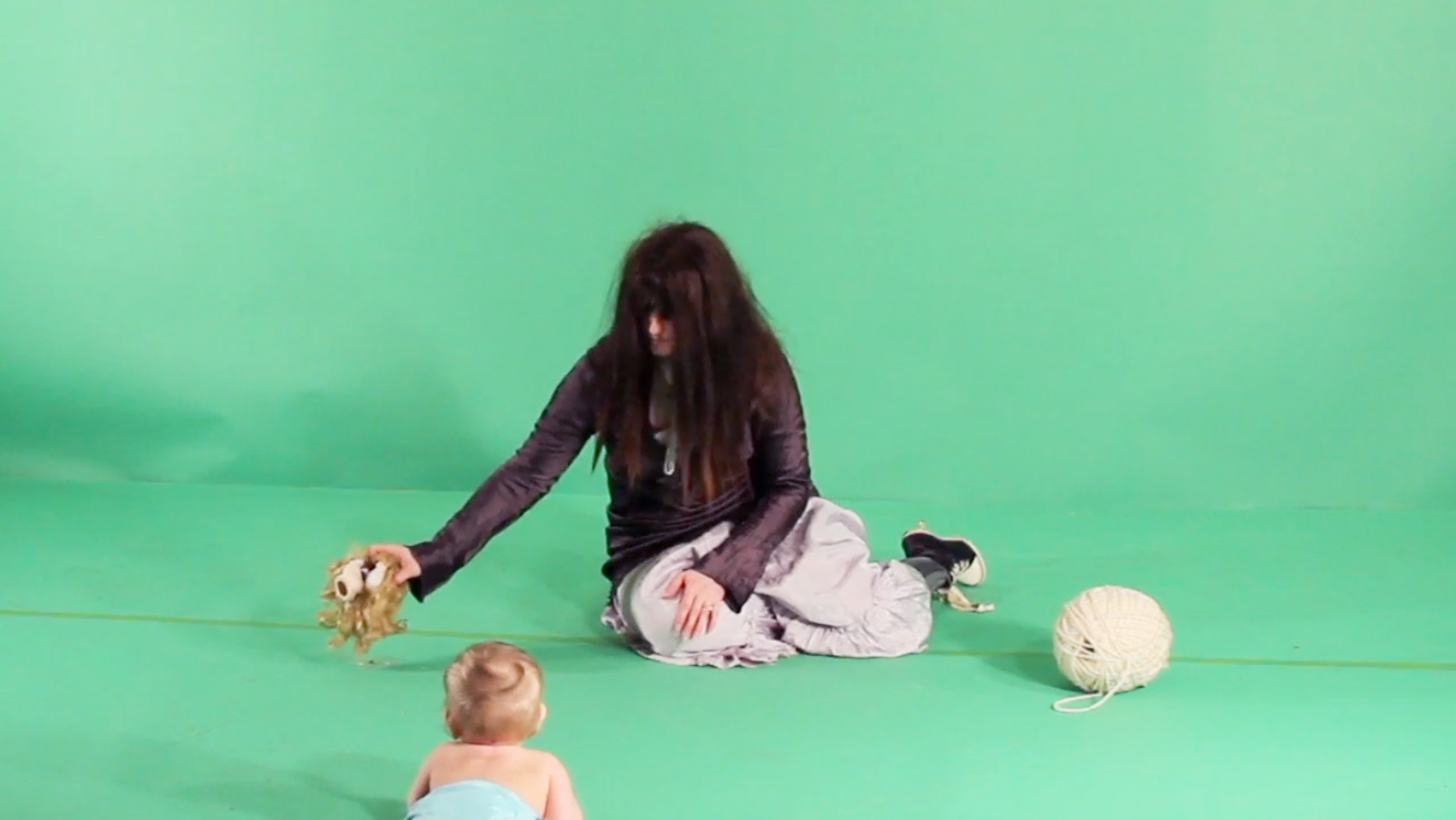 WITHOUT EYES IT CANNOT SEE ME (green screen video still)