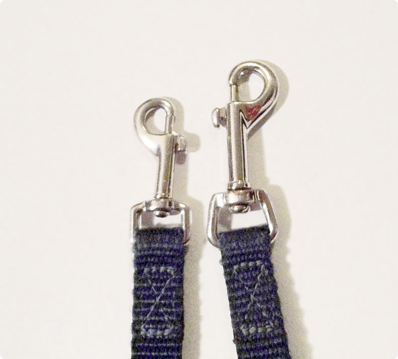 A proper double-ended leash will have two different clip sizes. The large clip attaches to the back ring on a harness; the small clip attaches to the chest ring.