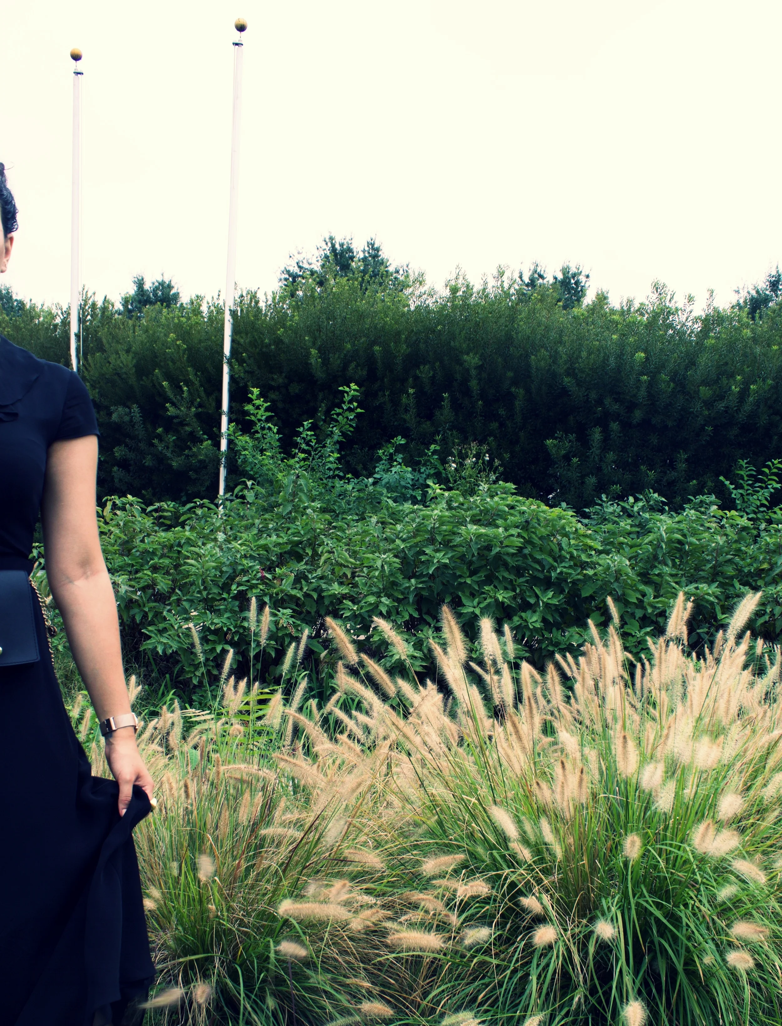 The ornamental grasses complement the elegance of the Shrine, as they surround the main stage. Their combination with the evergreen shrubs not only adds texture to the space, but also adds an element of softness to the Memorial, creating an unforget…