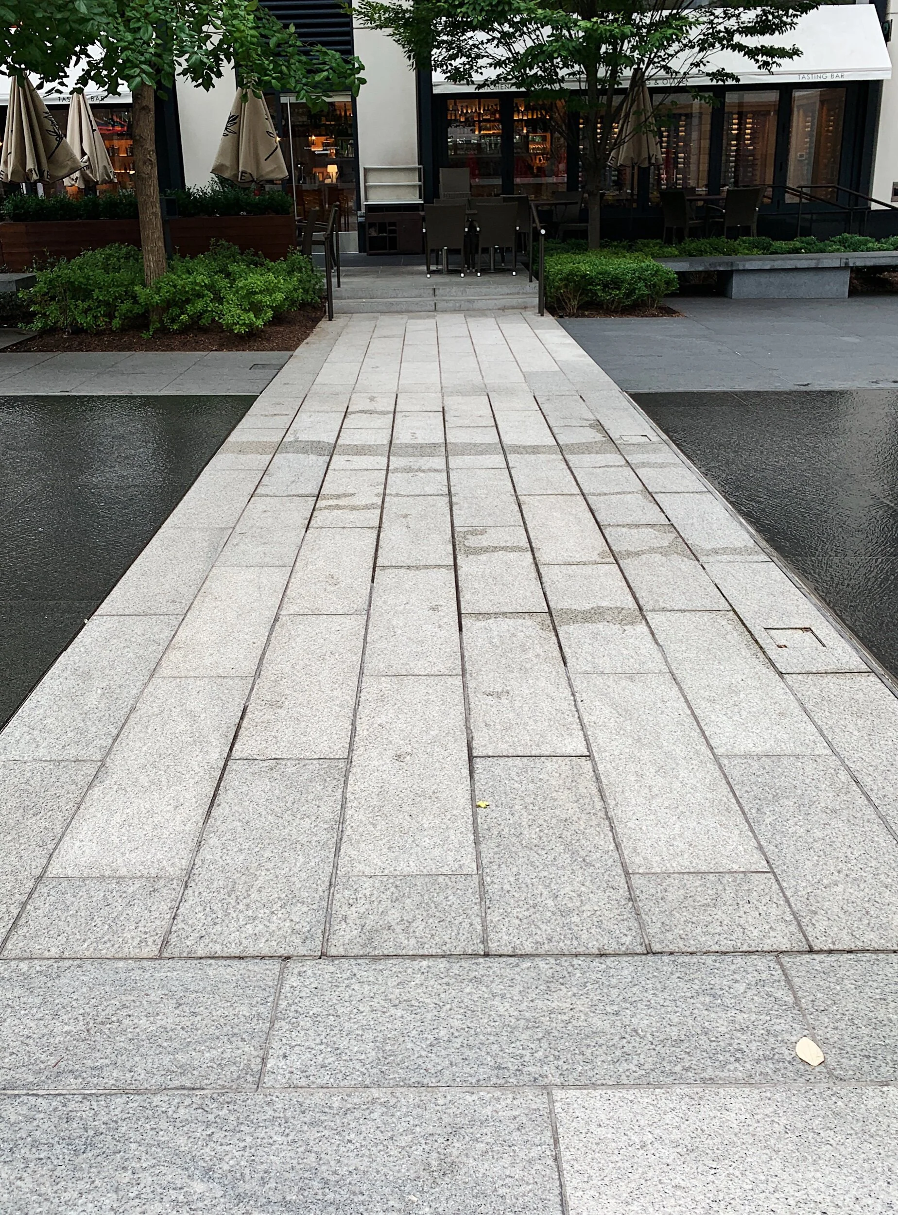 Path between leveled sheets of water at Central Plaza