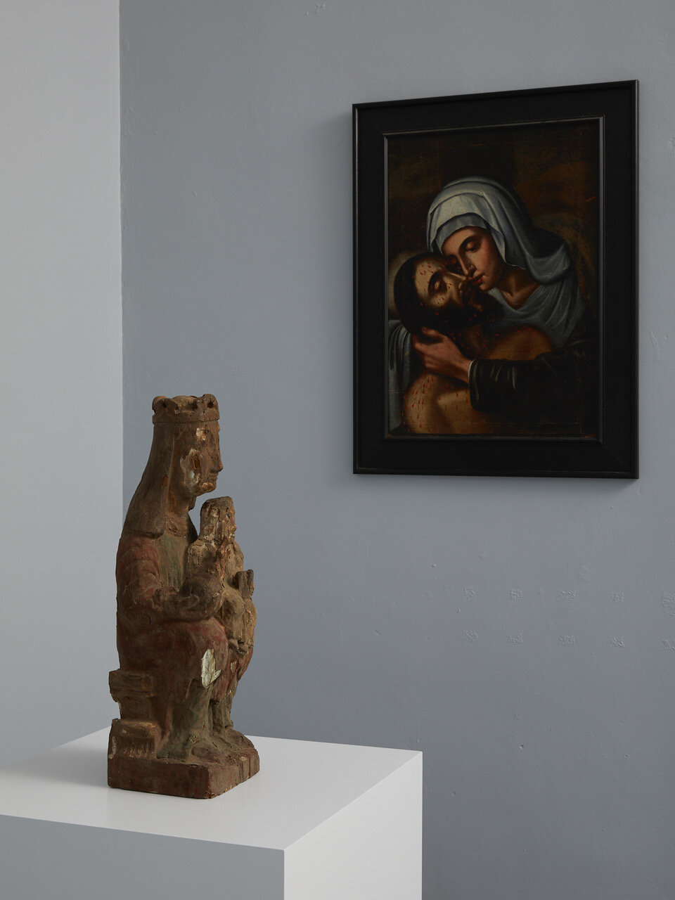 Left to right: Madonna and Child (Sedes Sapientiae) 12th - early 13th century, Northern Europe (probably Spain) 580 x 210 x 170mm Pieta 17th century, Spain 620 x 440mm