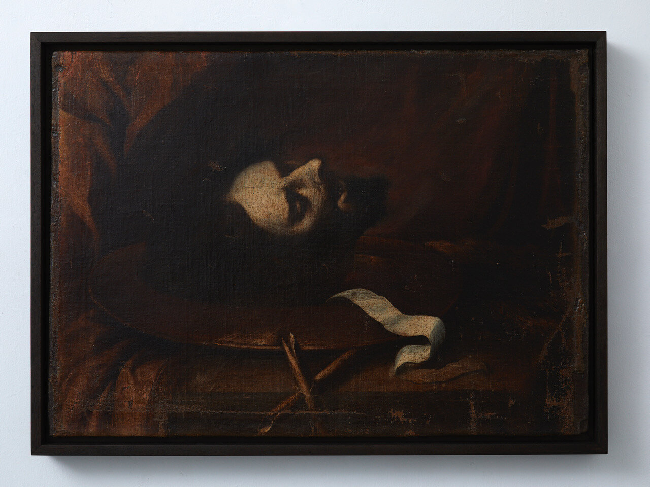 The Head of John the Baptist 17th century, Sevillian school (possibly from the workshop of Sebastian de Llanos Valdés) 555 x 770mm Provenance: Private collection, Madrid, Spain. Oil on canvas of the severed head of John the Baptist, on a metal pl