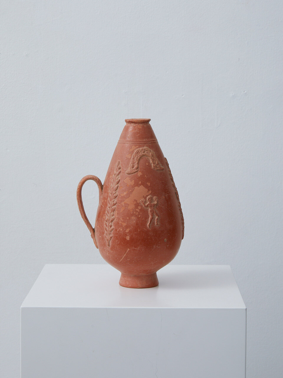 Roman Red-Slip Terracotta Jug (2) Late Imperial Period, 3rd century AD, North African (Tunisia) 180 x 120 x 100mm Provenance: Private collection, Munich, Germany. Roman narrow-mouthed piriform vessel distinctive of the North African pottery indus
