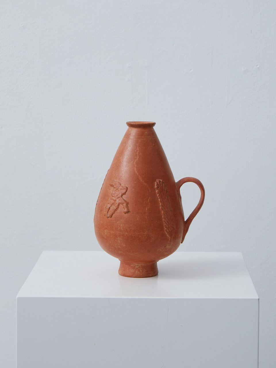 Roman Red-Slip Terracotta Jug (1) Late Imperial Period, 3rd century AD, North African (Tunisia) 150 x 101 x 90mm Provenance: Private collection, Munich, Germany. Roman narrow-mouthed piriform vessel distinctive of the North African pottery indust