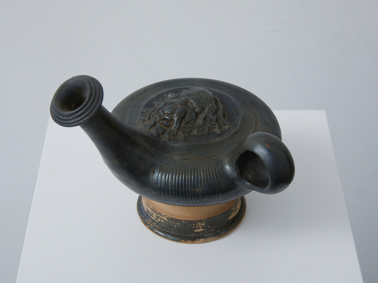 Campanian Black-Glazed Guttus Hellenistic period, 2nd half of the 4th century BC, Western Greek, Campania 135 x 150 x 115mm Provenance: L.J. collection, Netherlands; Private collection, USA. Campanian black-glazed guttus made from toned clay with