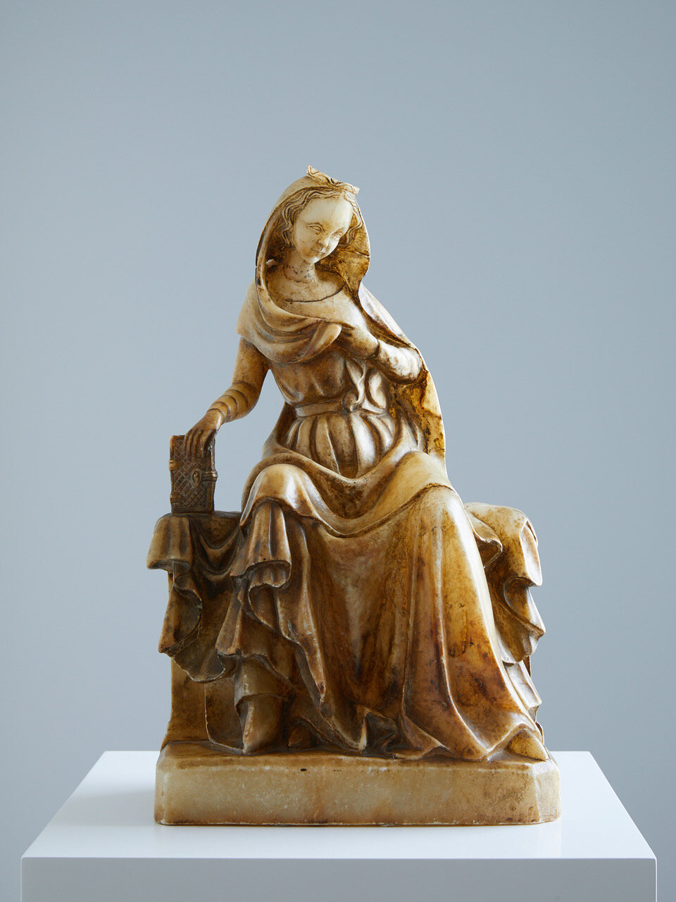 The Virgin of the Annunciation 15th century, Bohemia (Czech Republic) 430 x 260 x 150mm Provenance: Private collection, Madrid, Spain. A very fine carved alabaster statue of The Virgin of the Annunciation, surprised in her spiritual meditations b