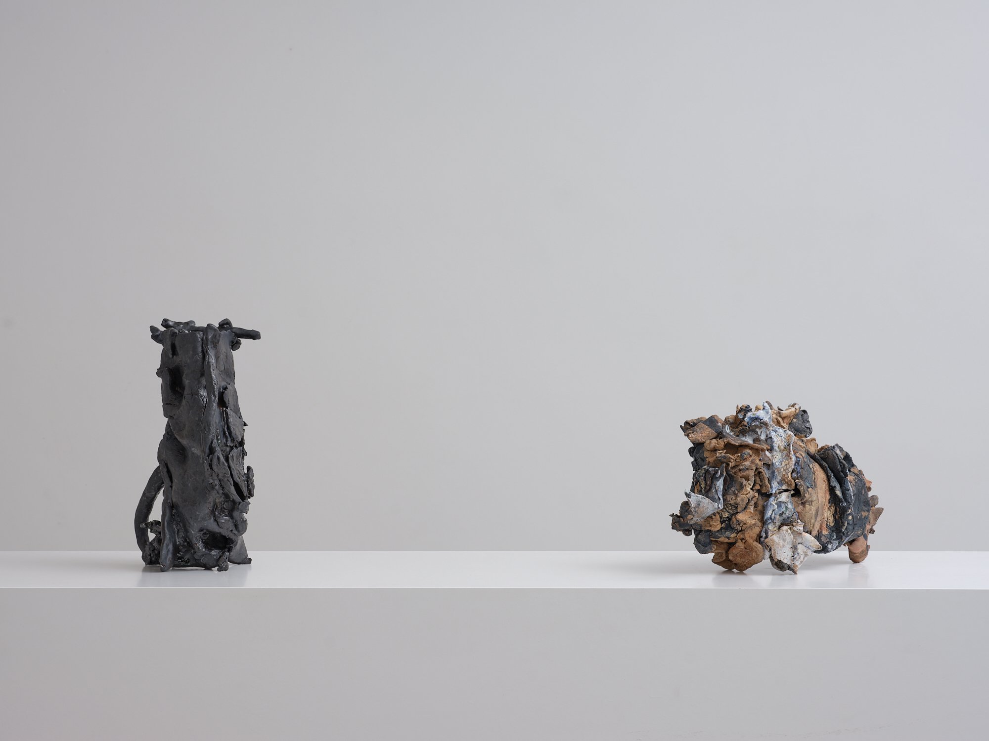 Left to right: Lapvona 2022/24 stoneware, glass, copper, ceramic scraps, ceramic pigment and oxide 300 x 130 x 170mm Mystery Pink 2023/24 stoneware, earthenware, porcelain, glass, ceramic scraps, ceramic pigment and oxide 200 x 360 x 130mm