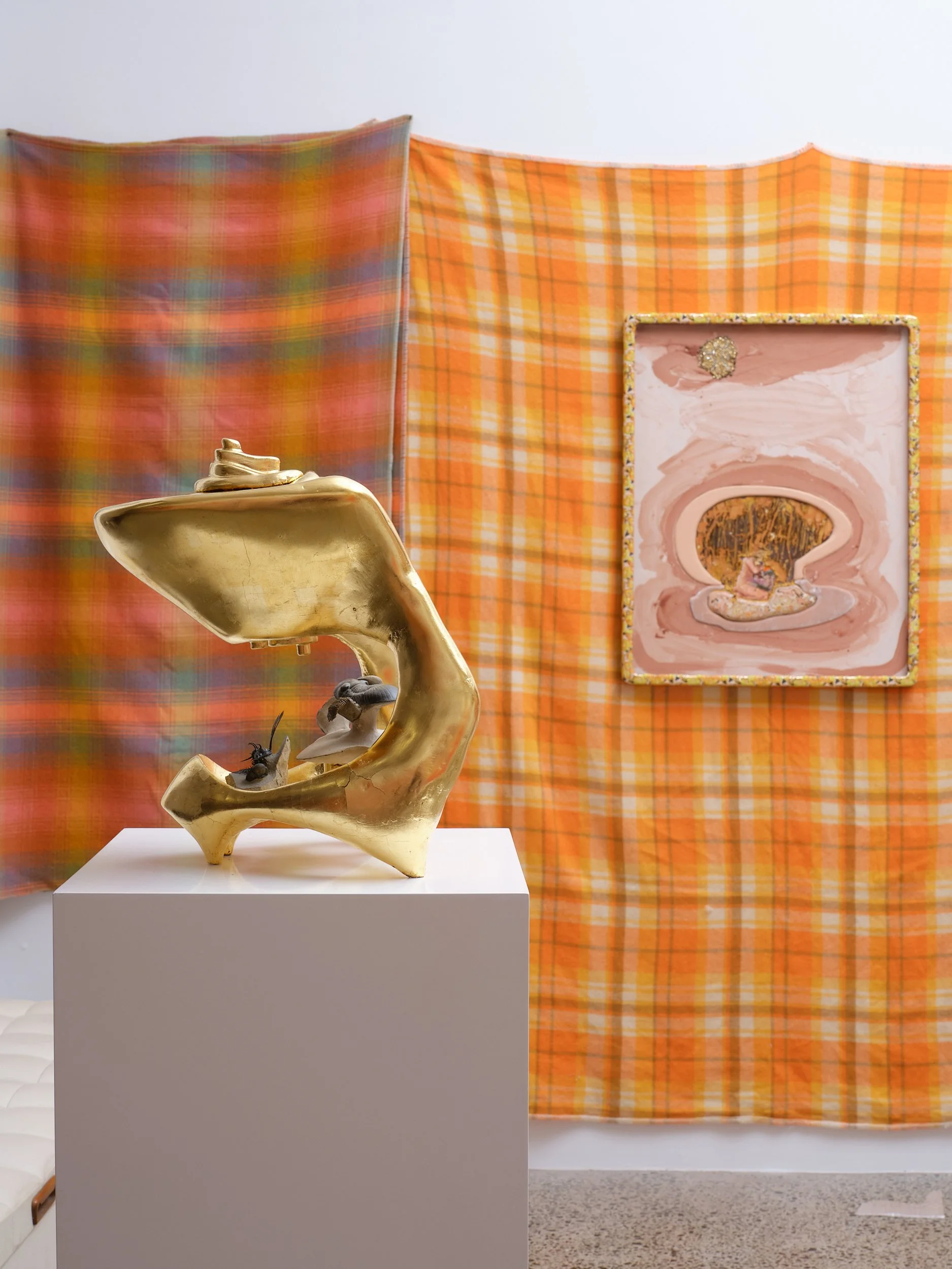  Left to right:   Self Portrait with Chamber Music: feat. Walliserops, Flying Paralejurus, Crotacephalina and Reedops  2025-26 Wood, gesso, bole, gold, limestone 255 x 230 x 360mm   Figure (a)  2026 Gouache, bole, gesso, gold, metallic paint, iridesc