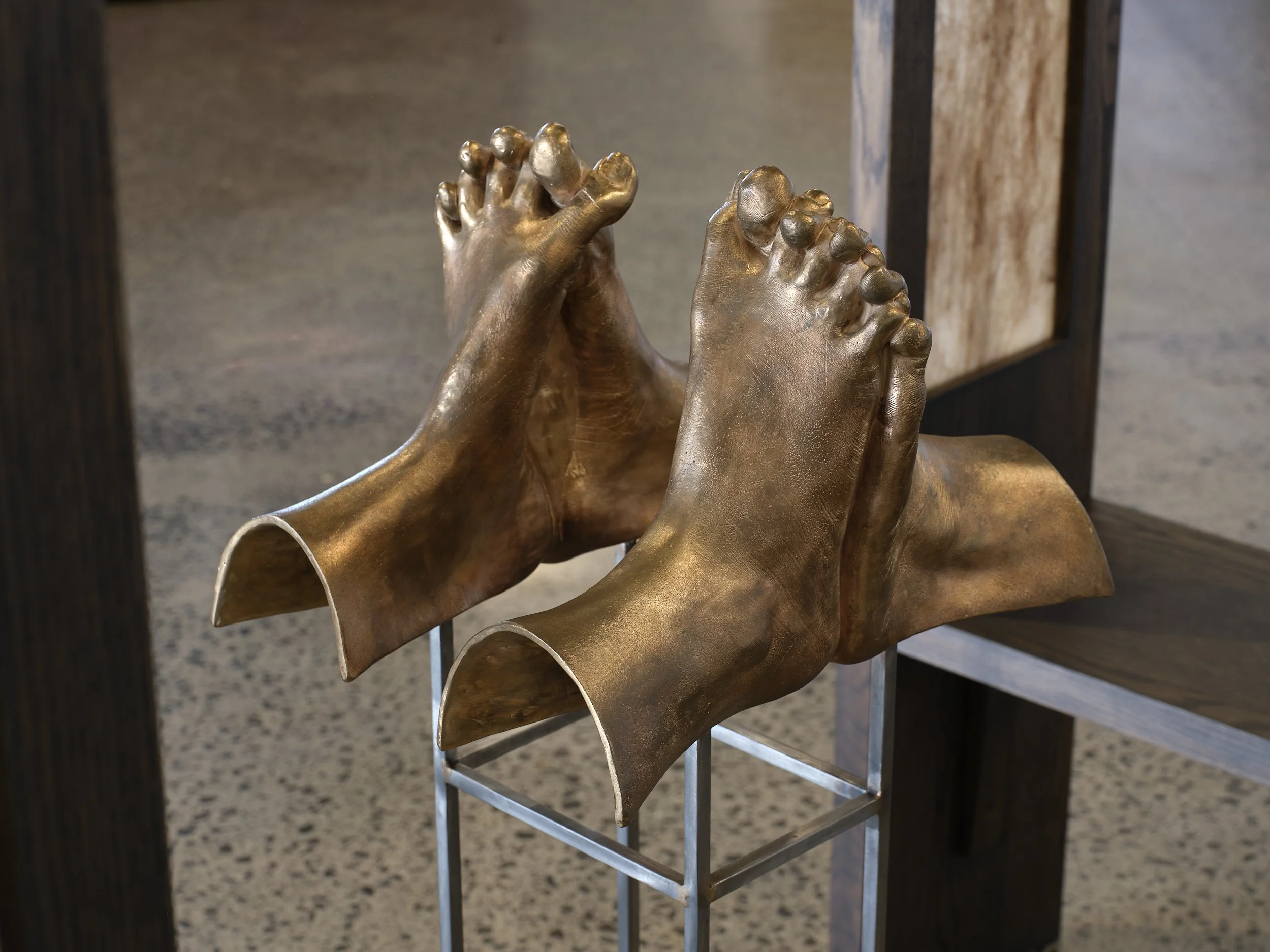   Apology  (detail) 2025 American oak, brazed steel, cast bronze, felted wool, human hair, cotton  Installation view, Erika Holm, Ngaroma Riley, Tarika Sabherwal -  Echo  Artspace Aotearoa, 2025 Image: Sam Hartnett 