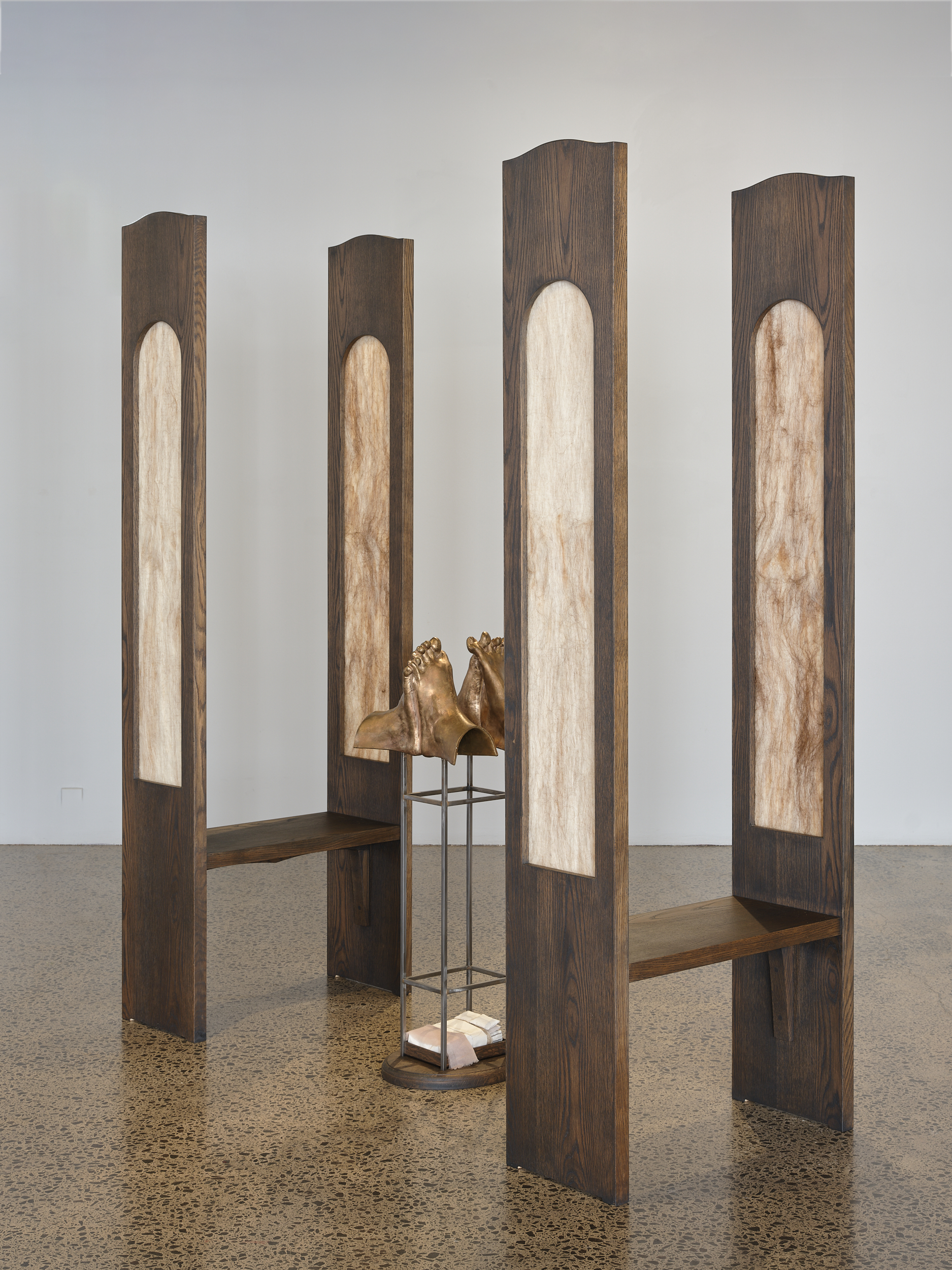   Apology  2025 American oak, brazed steel, cast bronze, felted wool, human hair, cotton  Installation view, Erika Holm, Ngaroma Riley, Tarika Sabherwal -  Echo  Artspace Aotearoa, 2025 Image: Sam Hartnett 