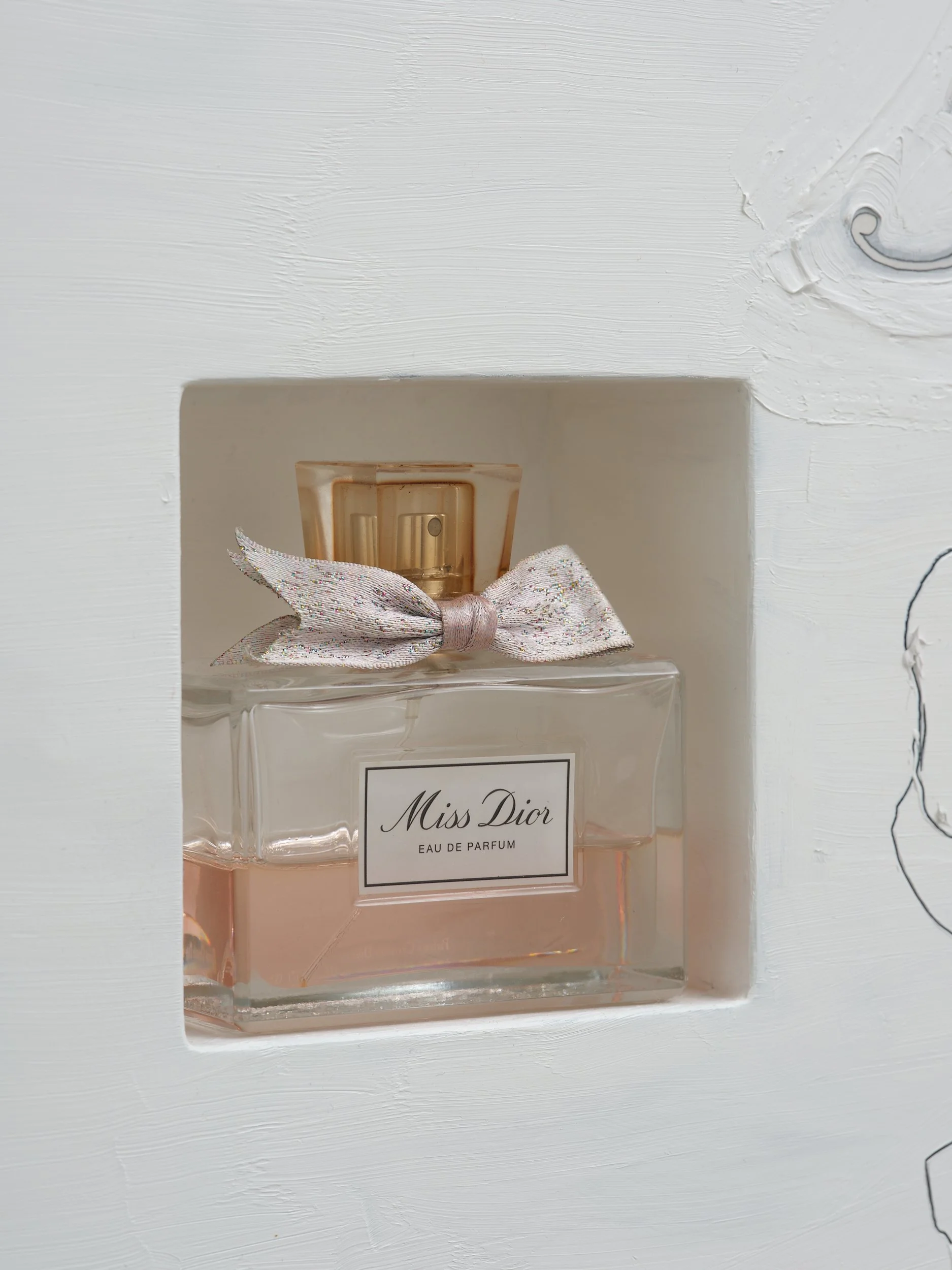   Miss Dior  (detail) 2026 Oil, pencil, paper on wood, bottle, resin 950 x 400 x 100mm 