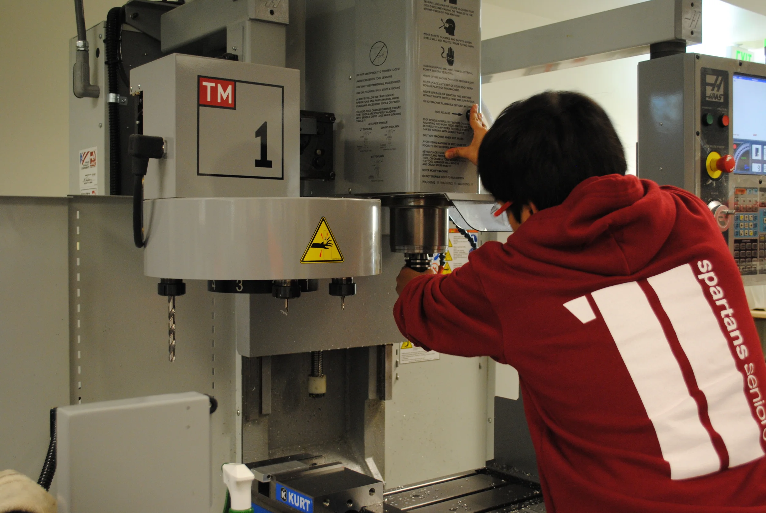 Setting up a CNC milling machine to run a part that I designed in Autodesk Inventor and programmed in EdgeCAM.