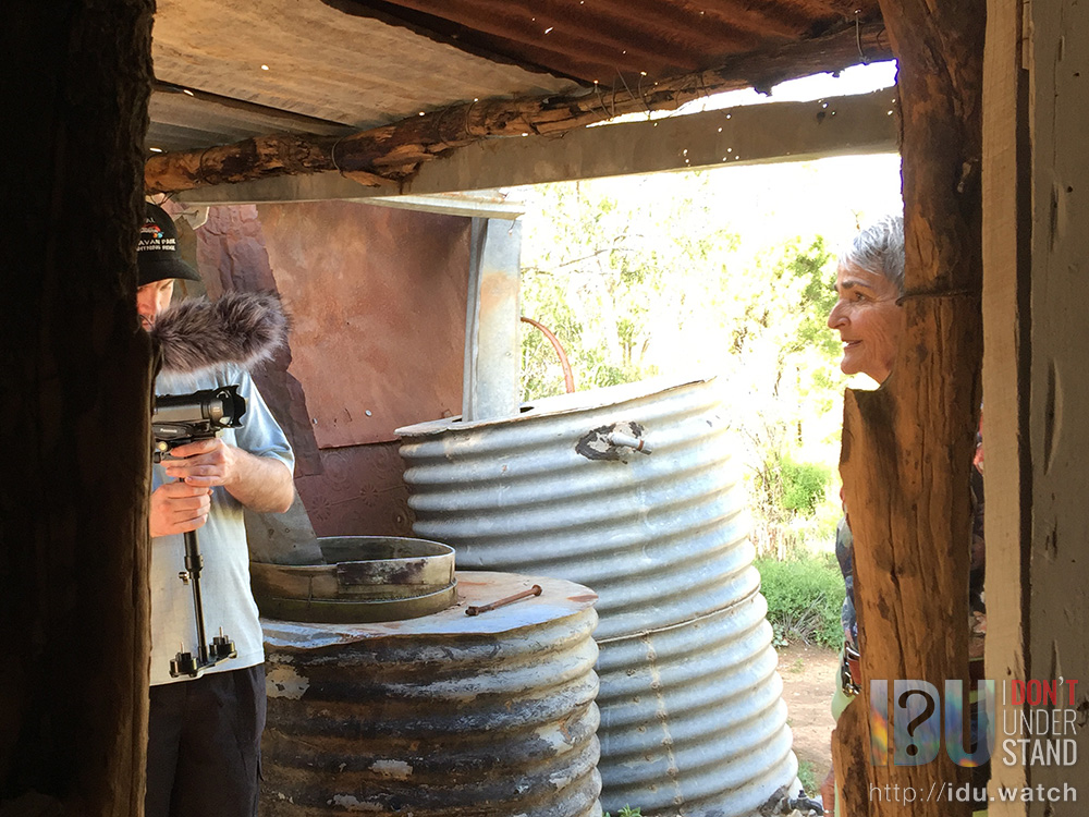 Filming some unused conversation in the breezeway of Fred Bodel's hut.