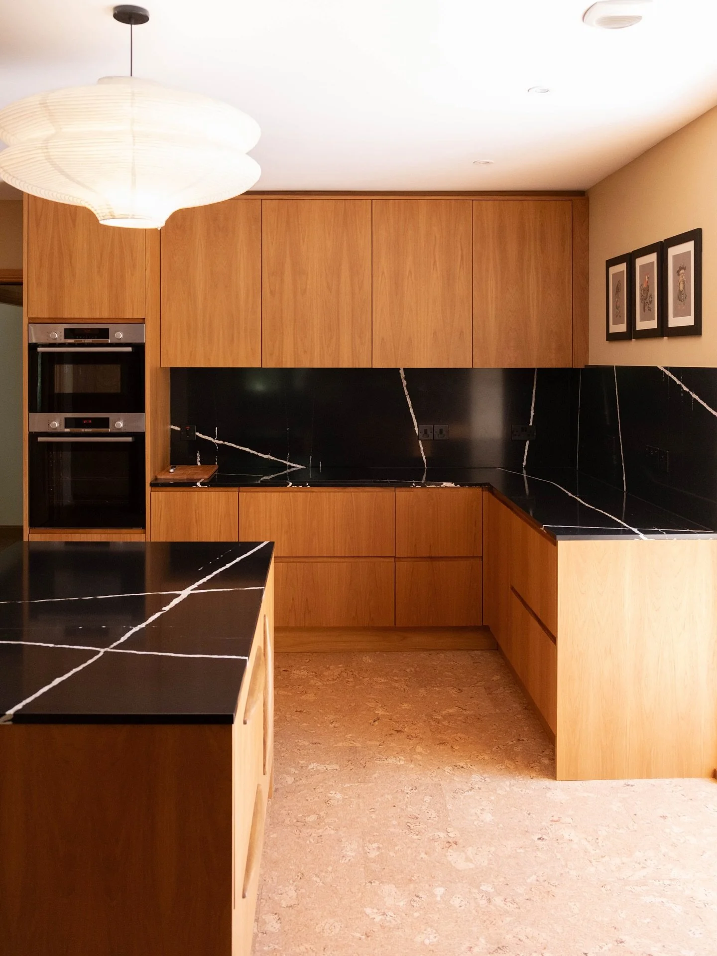 Teak kitchen doors in a beautifully restored mid-century property. 

The natural grain patterns and warm honey tones showcase why teak remains the premium choice for period-correct renovations. Our veneered doors were carefully selected for consisten