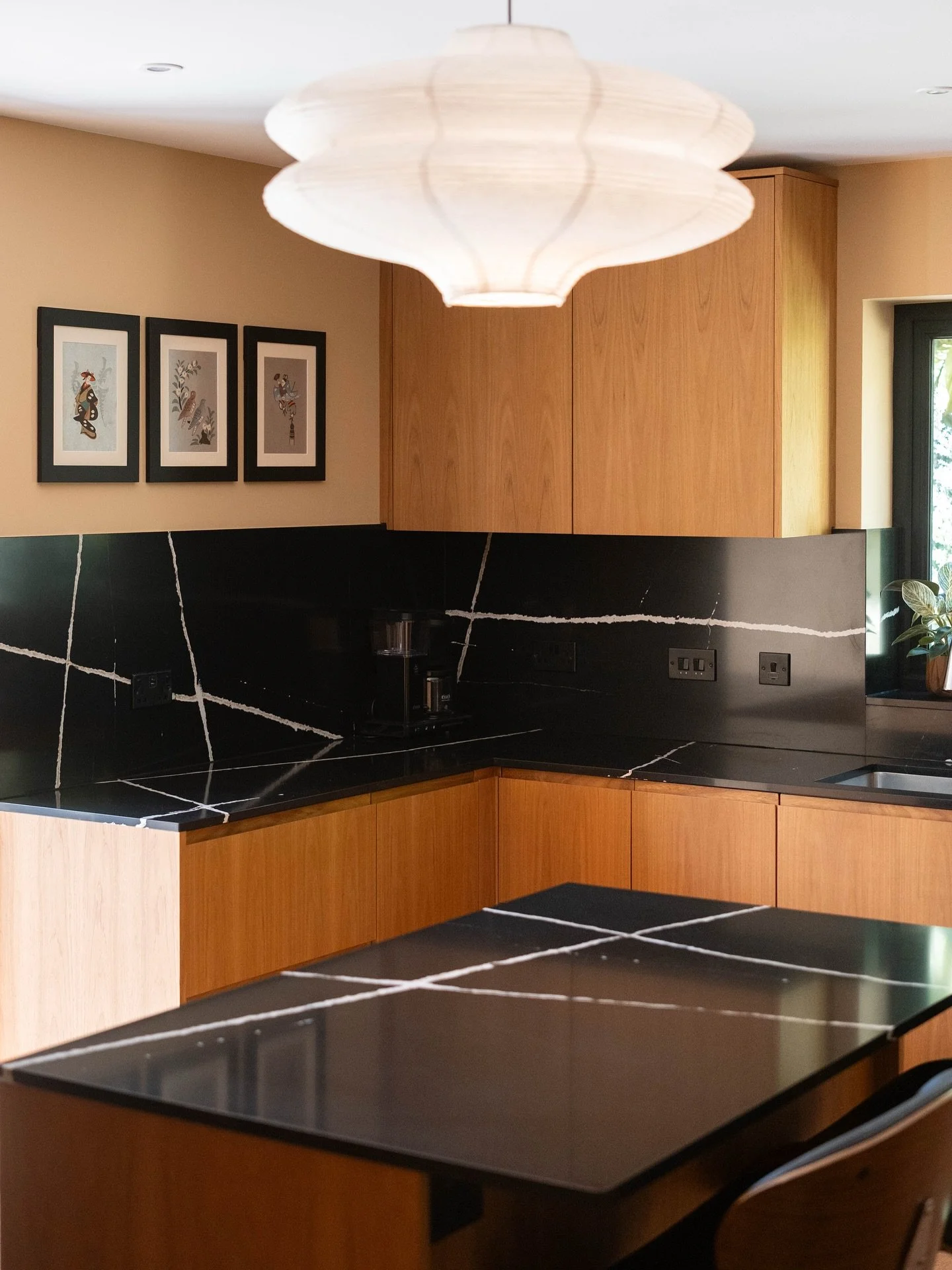 Some more angles of this stunning Teak kitchen.

These images show the 3 different handle style used in the kitchen, alongside some hidden pull outs. 

The natural grain patterns and warm honey tones showcase why teak remains the premium choice for p