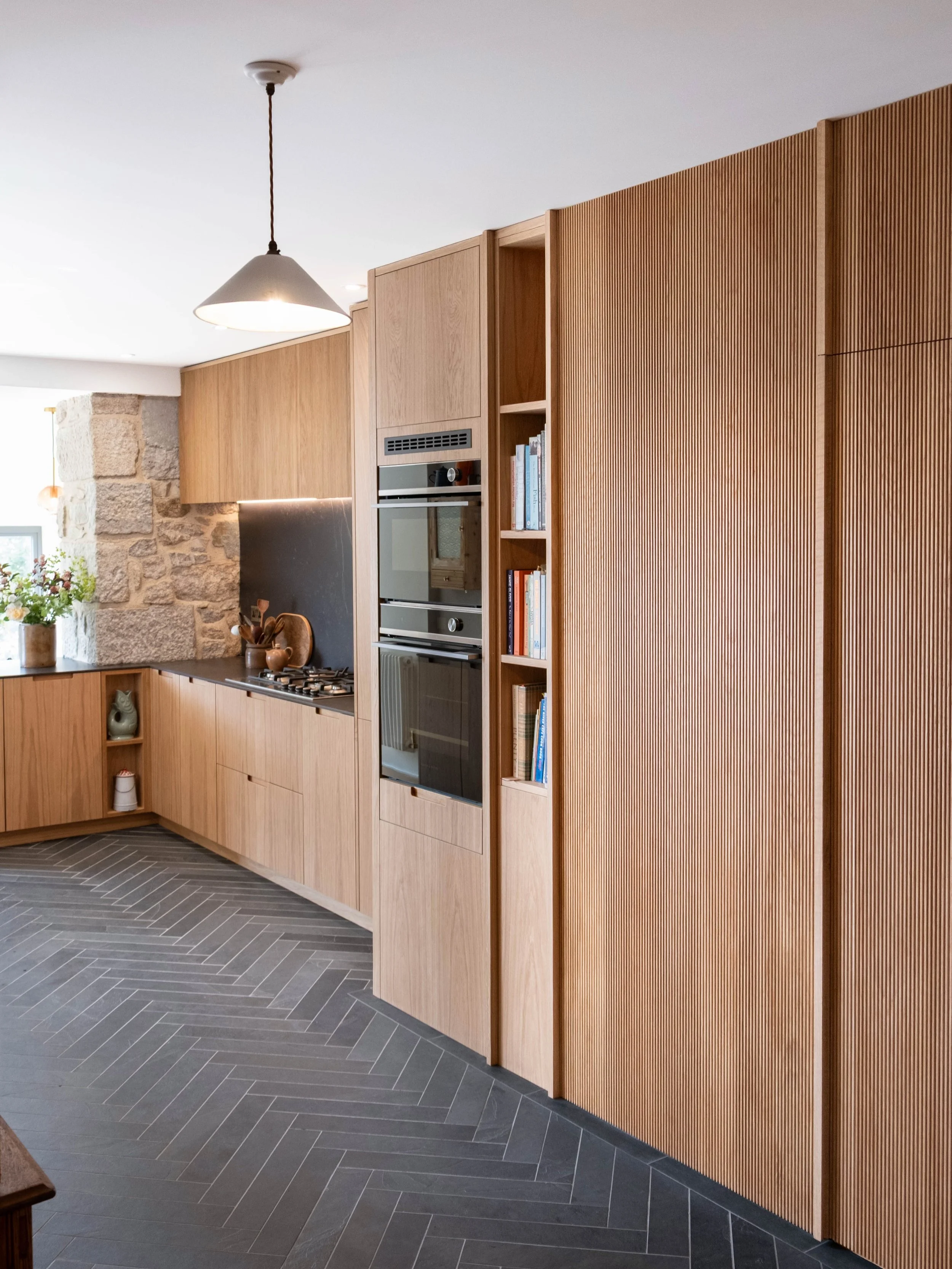A stunning kitchen in a beautifully renovated townhouse at the top of Penzance. 

This kitchen features large amounts of pull-out storage, including; drawer pull outs, spice pull outs &amp; hidden bins. Some beautiful appliances from Fisher and Payke