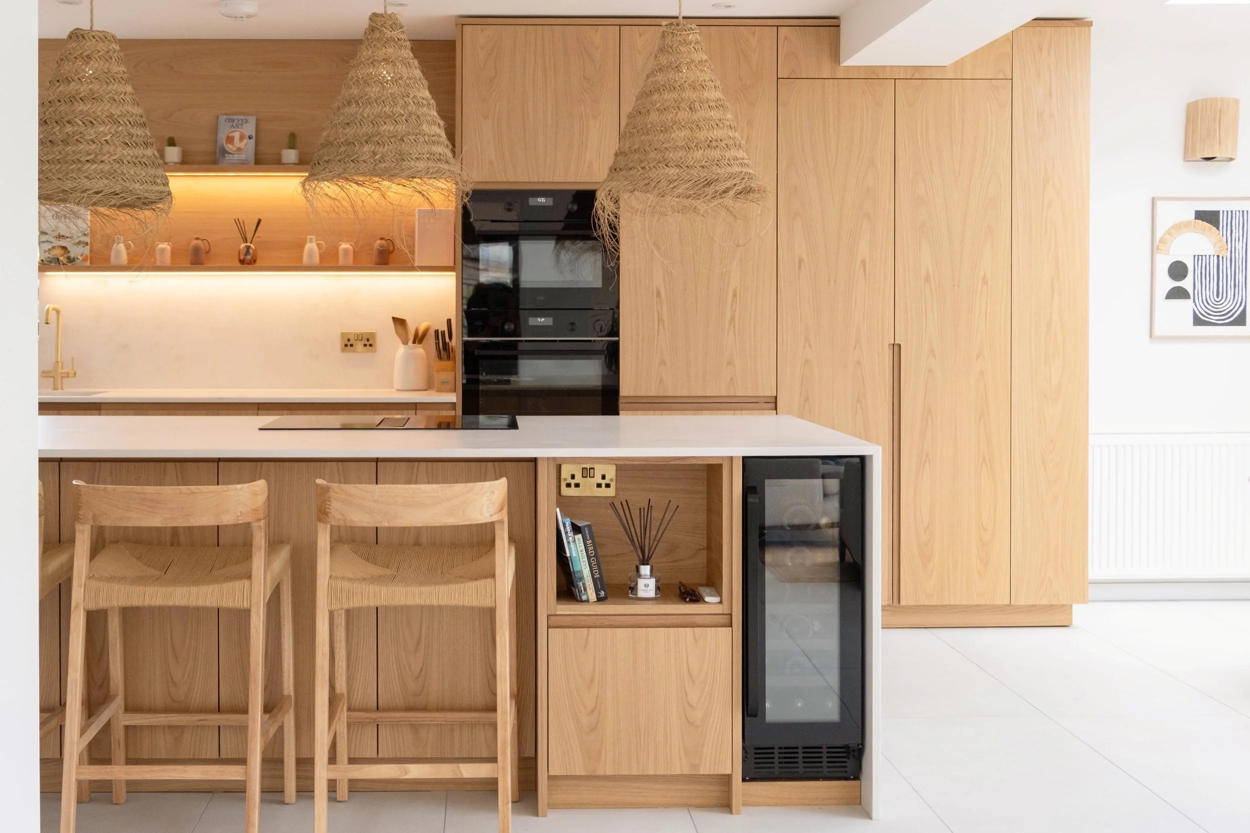 A recently completed project in Carbis Bay.

Some beautiful crown cut oak with a really lovely grain. All the lovely handle details, open units, larder internals, drawers, and cladding all in the same finish making for a really stunning project. 

 A