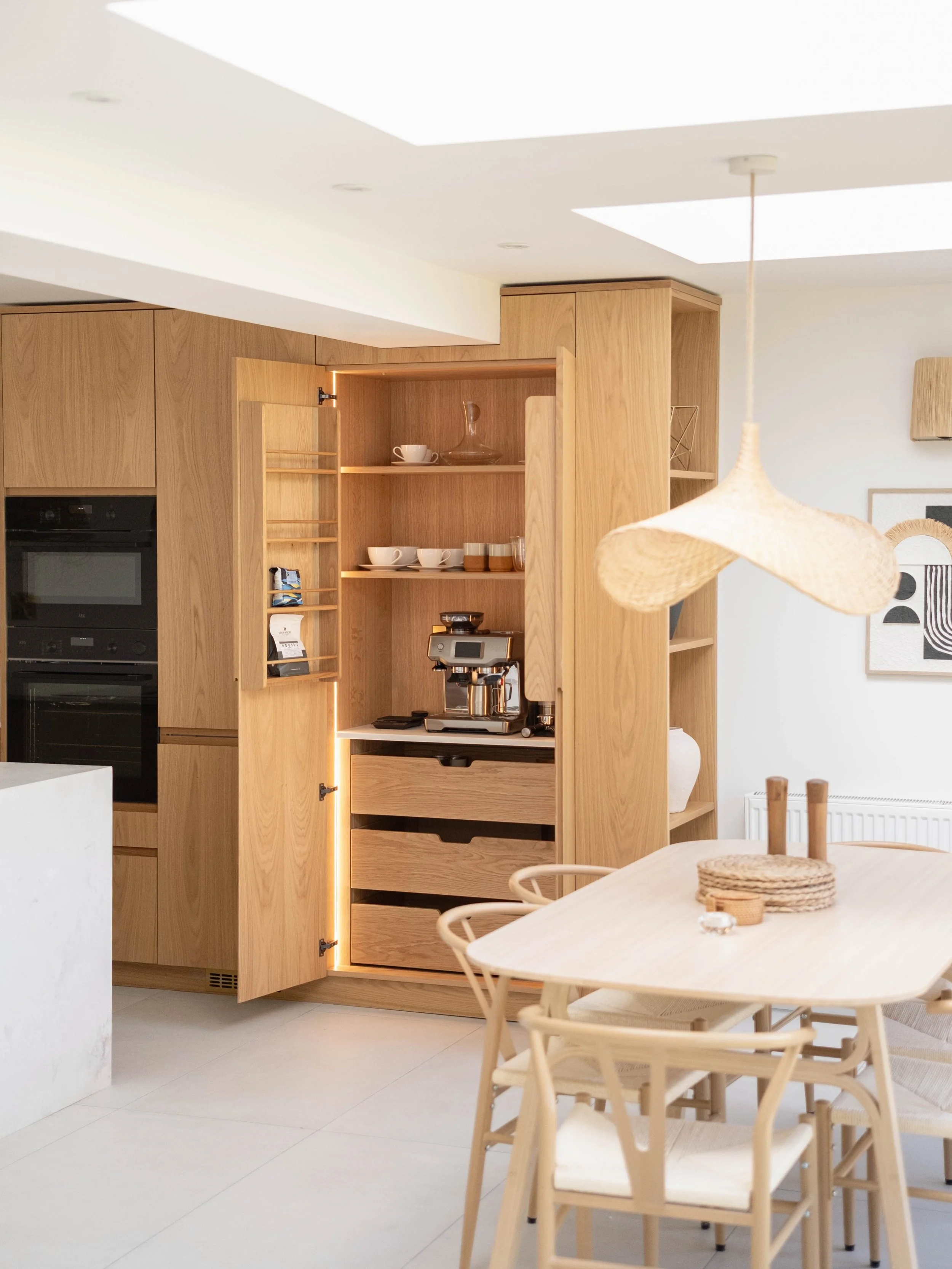 A recently completed project in Carbis Bay.

Some beautiful crown cut oak with a really lovely grain. All the lovely handle details, open units, larder internals, drawers, and cladding all in the same finish making for a really stunning project. 

 A