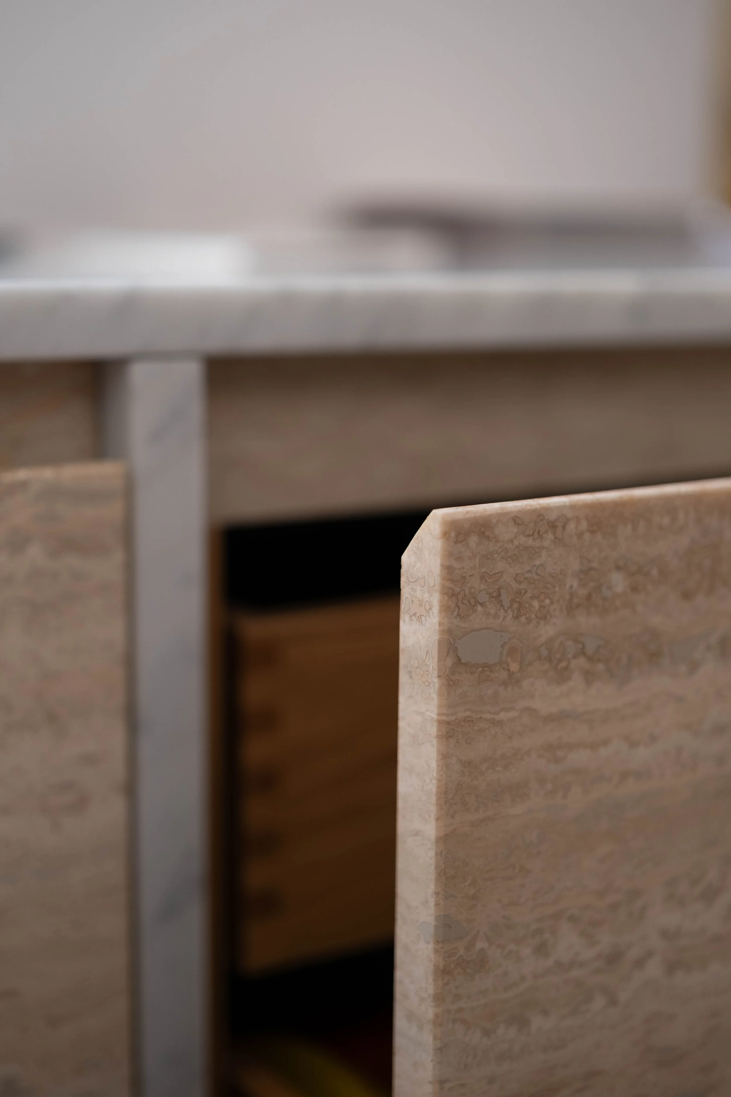 Close-up of various granite and marble countertops in different colors and patterns.
