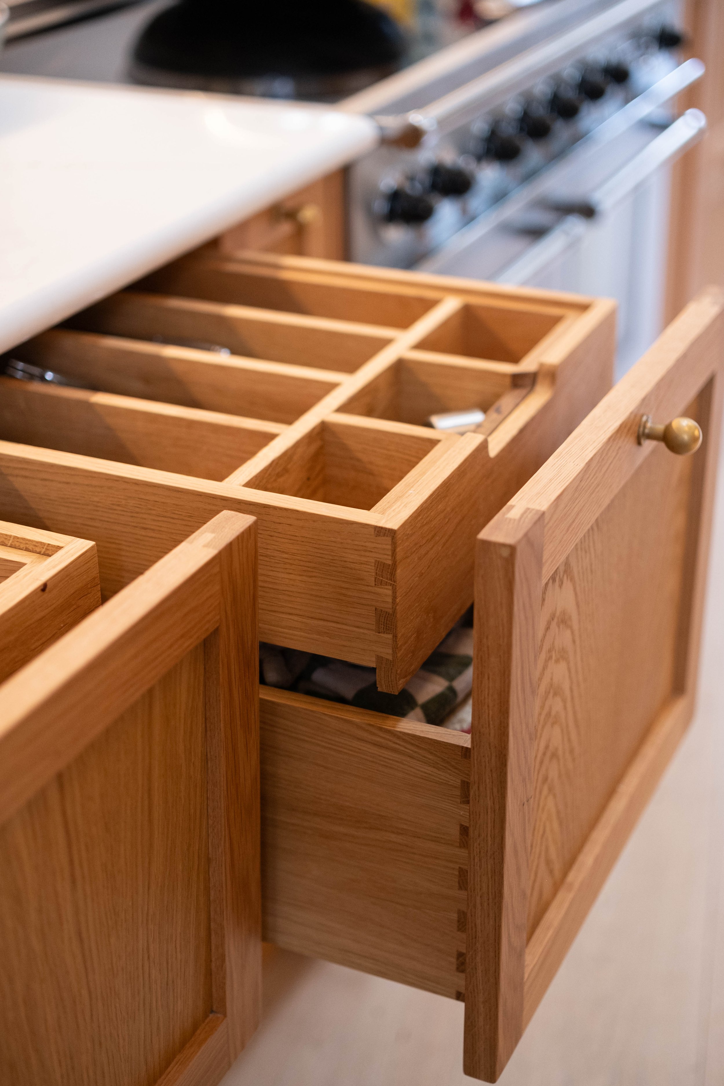 Empty wooden kitchen spice rack drawer.