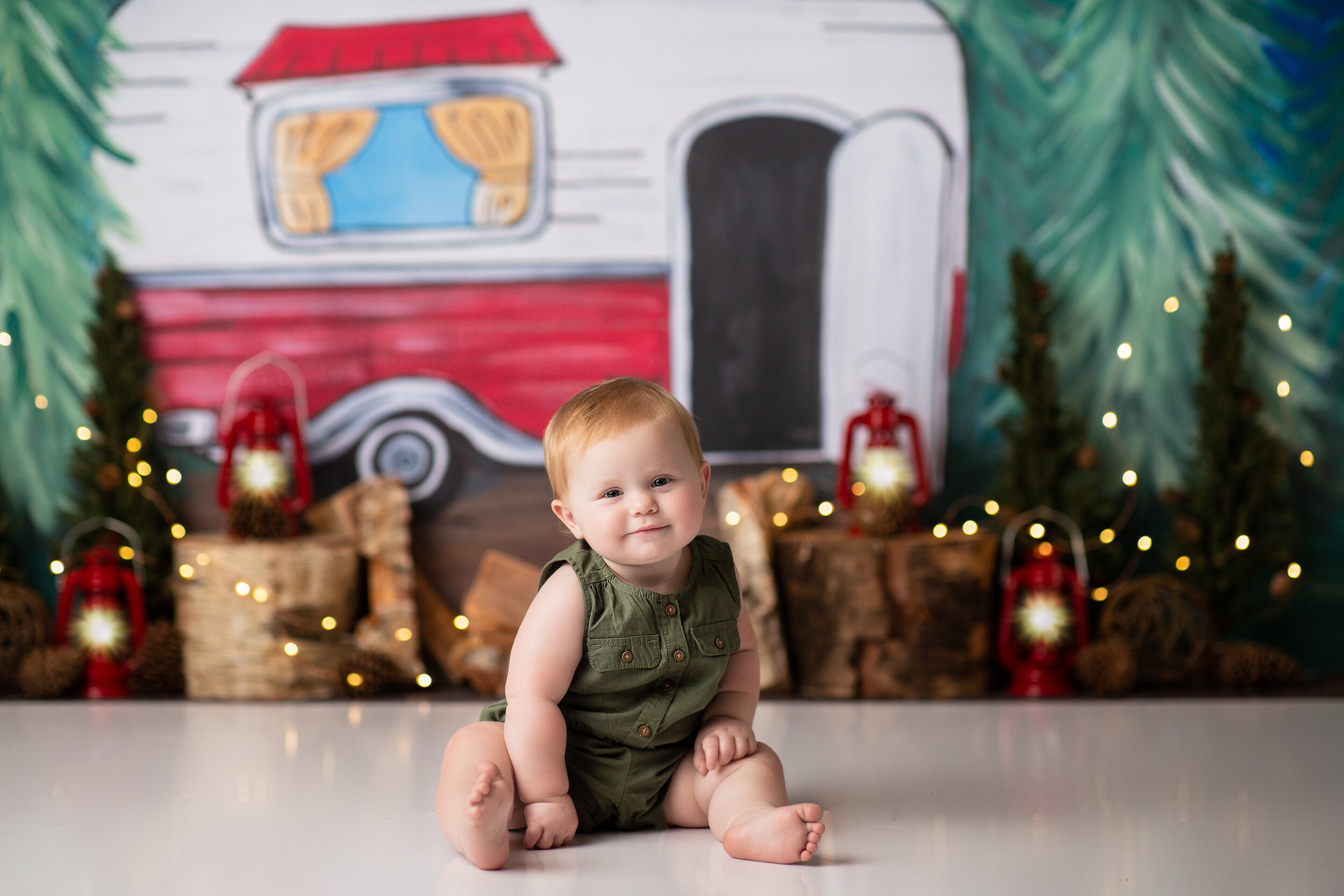  Chunky baby in studio for his one year milestone photos, customized with a camper theme 