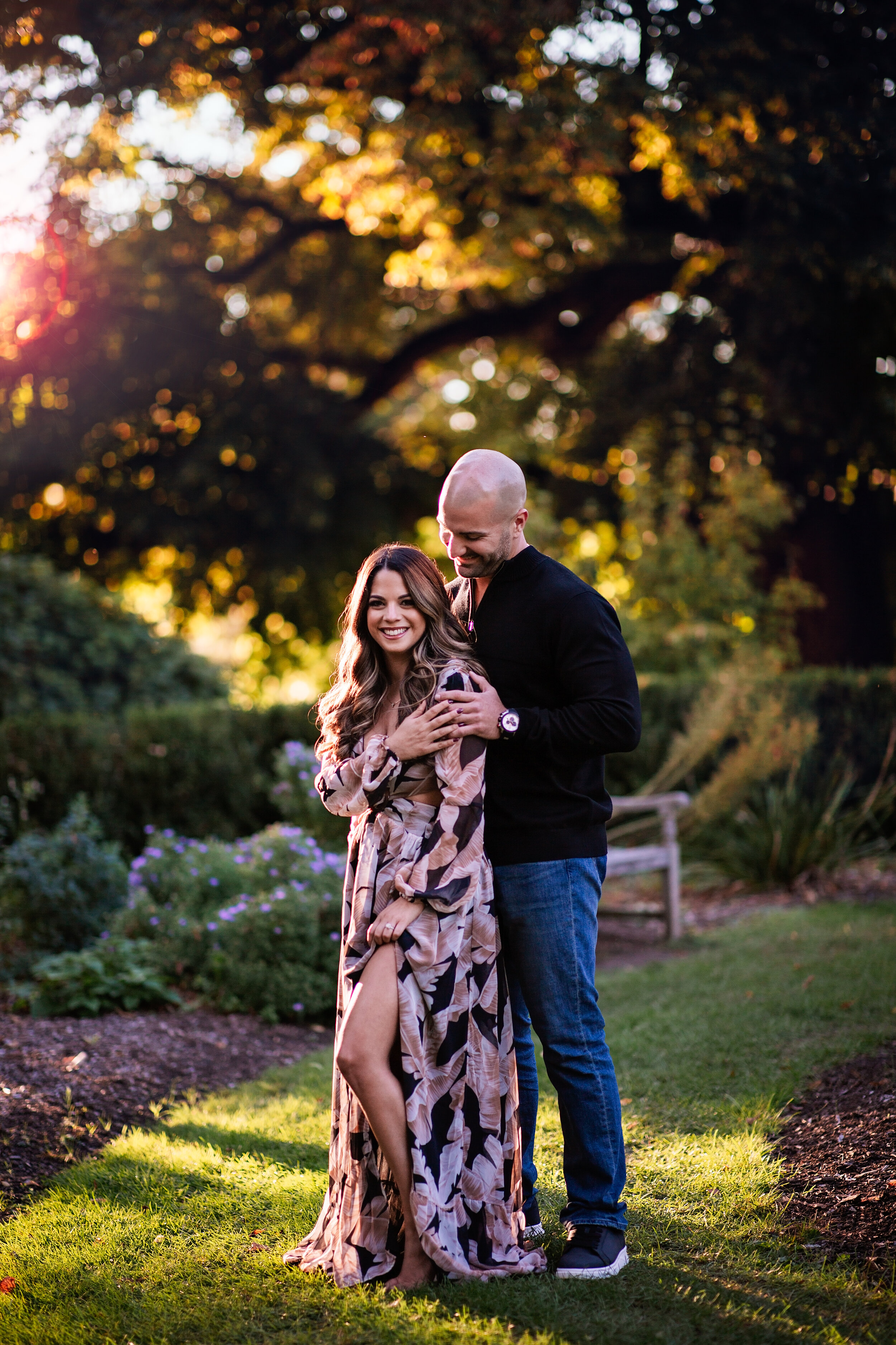  Young man and woman in a New Jersey park during their couples photoshoot 