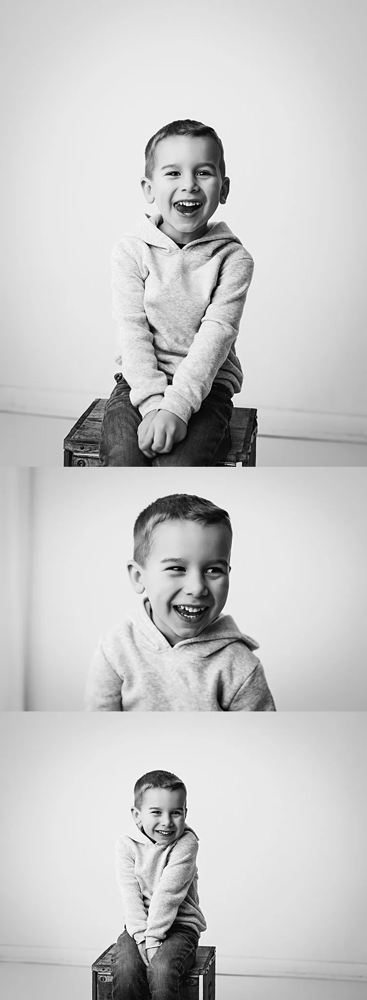 Black and white portraits of young boy in jeans and a hooded sweatshirt smiling in a New Jersey studio
