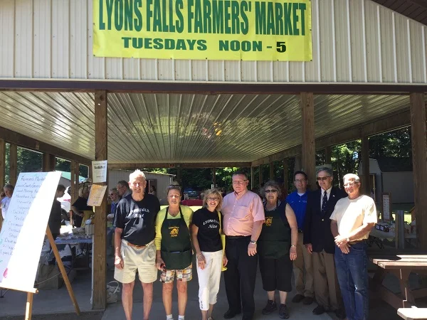 Christine Chaufty (third from the left) devoted a lot of her time away from work on such community endeavors as the Lyons Falls Farmers Market. Photo: LivingInLewisCounty.com