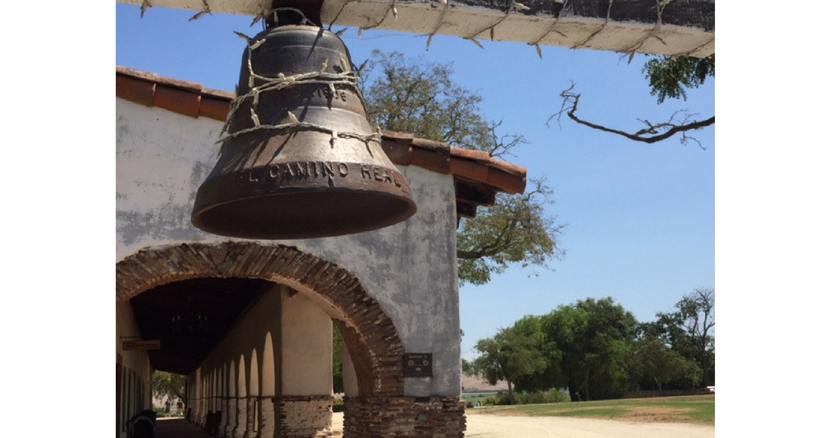 The bell in front of San Juan Bautista along Camino Real, translated as Royal Highway. Photo by Steve Newvine
