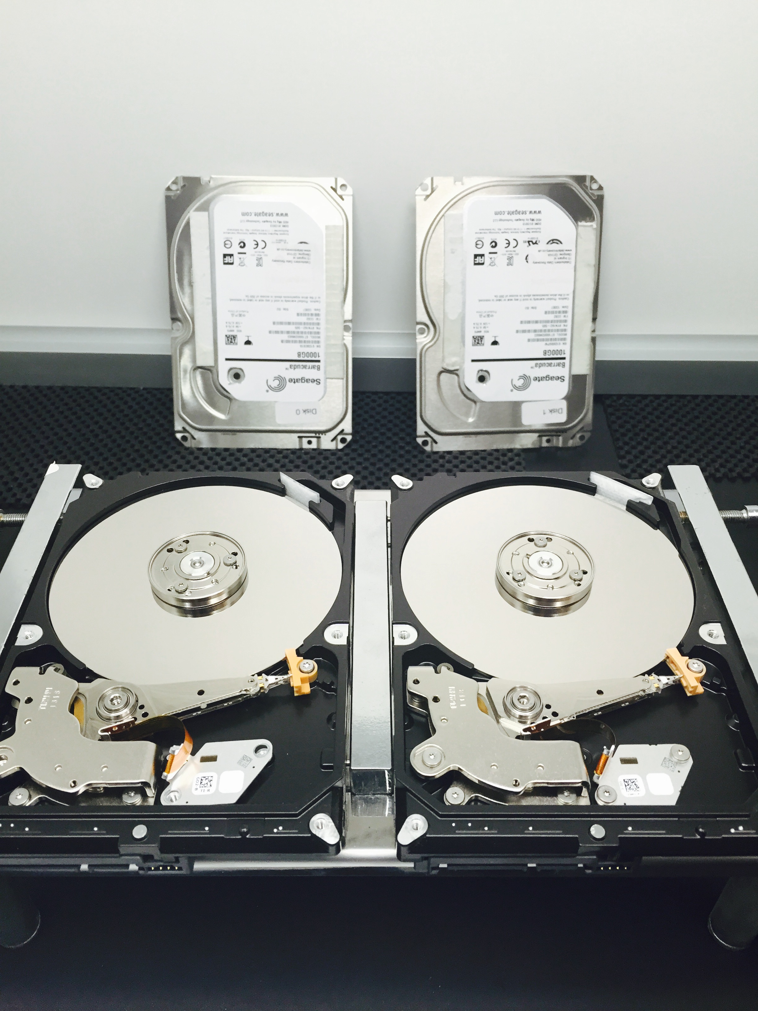 Seagate St1000dm003 drives opened up in the cleanroom awaiting head swap 