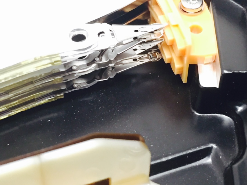 Normally bent heads that you can see here would not bother me so much, some drives wont keep spinning ling enough to kill themself but in this case you can see scattered bits of disk everywhere. This is definitely game over :( 