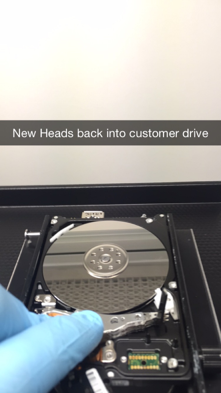 Here I am fitting the new fresh heads that will replace the faulty ones and allow us to recover the customer drive. 