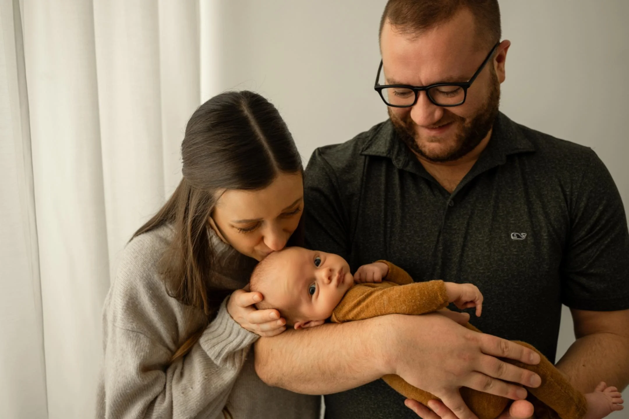 Last year I updated the studio to offer a lifestyle option.  I&rsquo;m loving these more casual and organic newborn images and I offer a studio newborn lifestyle session that focuses soley on these types of images. But...even in my regular posed and 