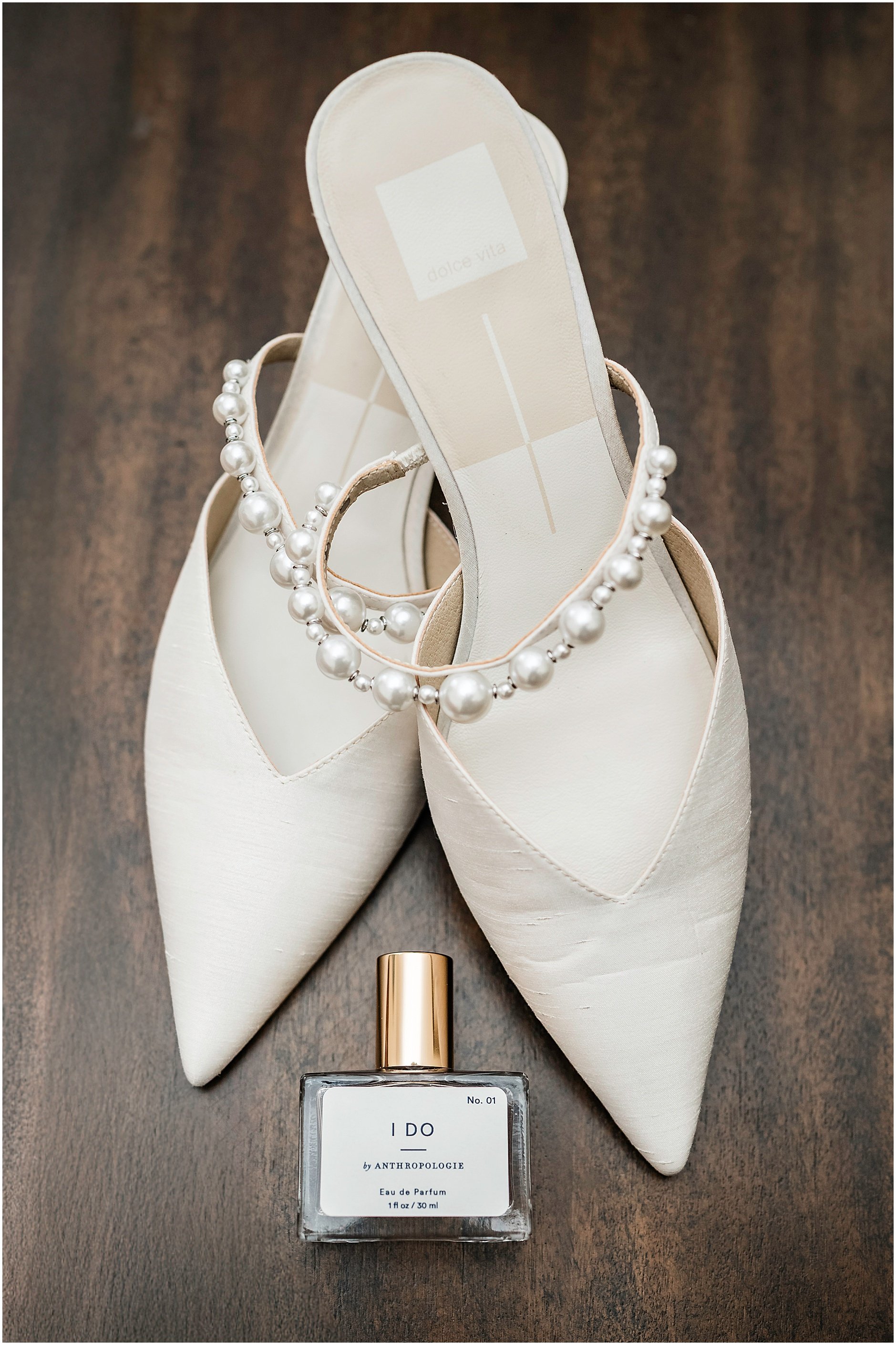 Beautiful shoes with pearls on the straps for the bride as she walks down the aisle at her Spring wedding in Upstate, NY.