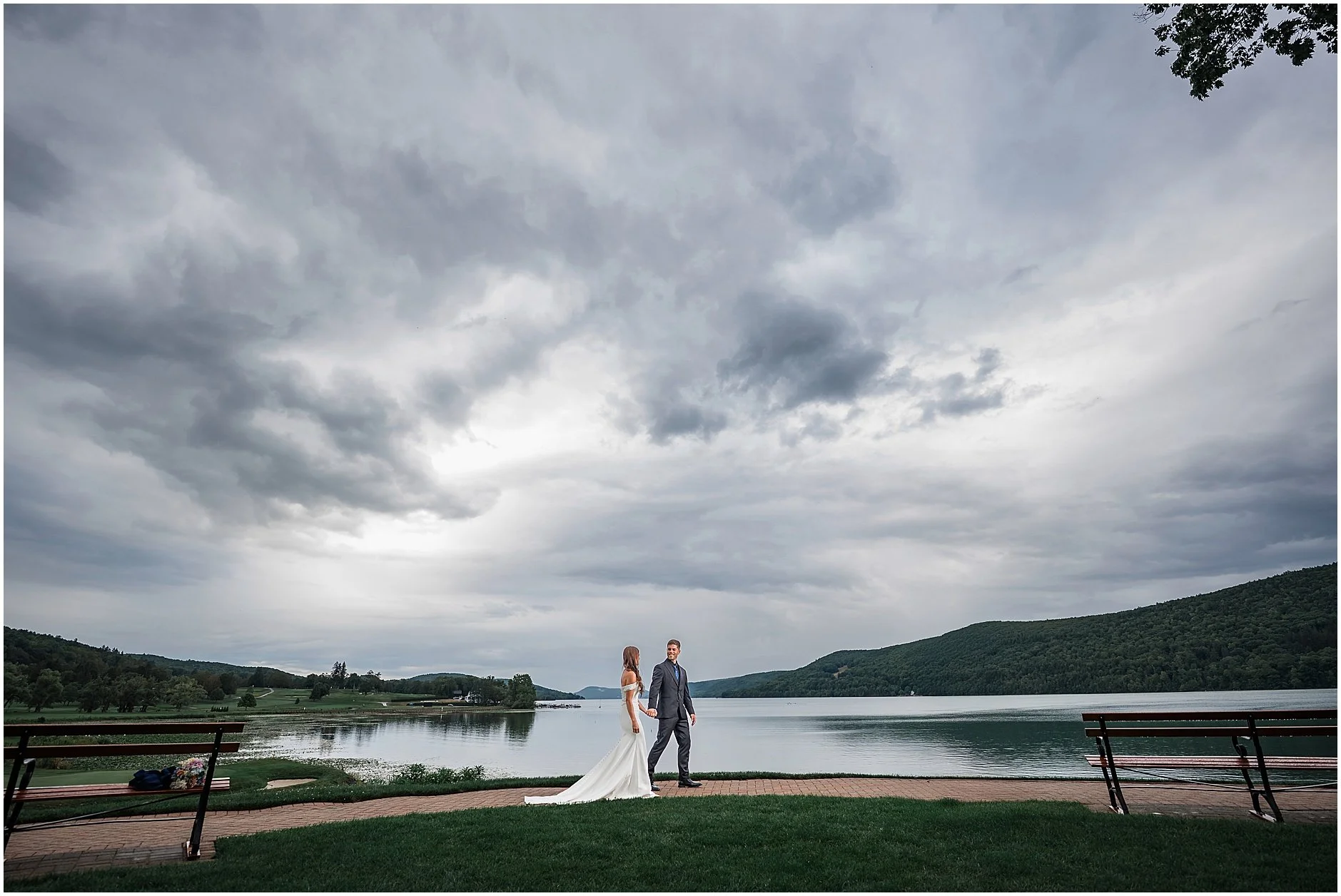 Couple walking near Otsego Lake during a romantic elopement in Cooperstown, New York.