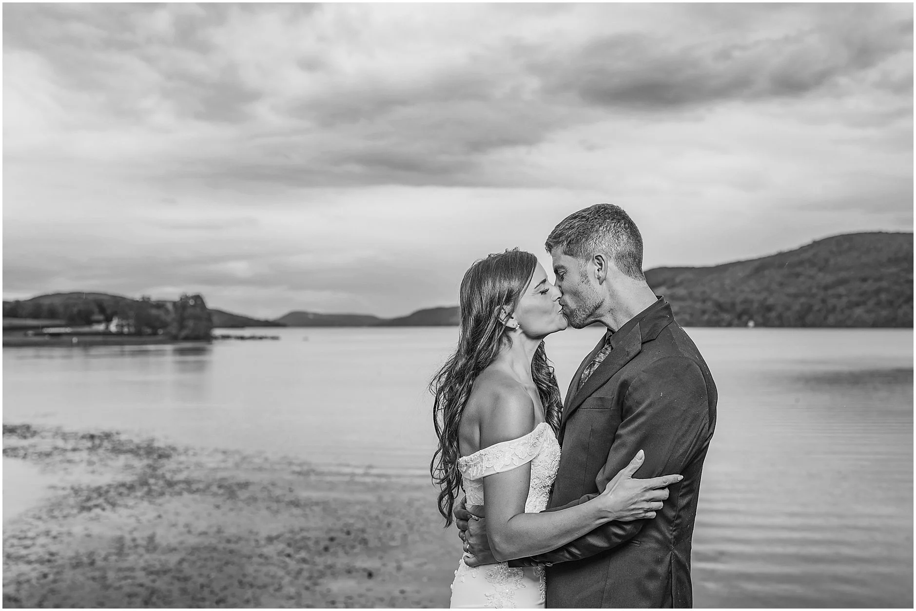 Romantic couple sharing a kiss during a Cooperstown, New York elopement.