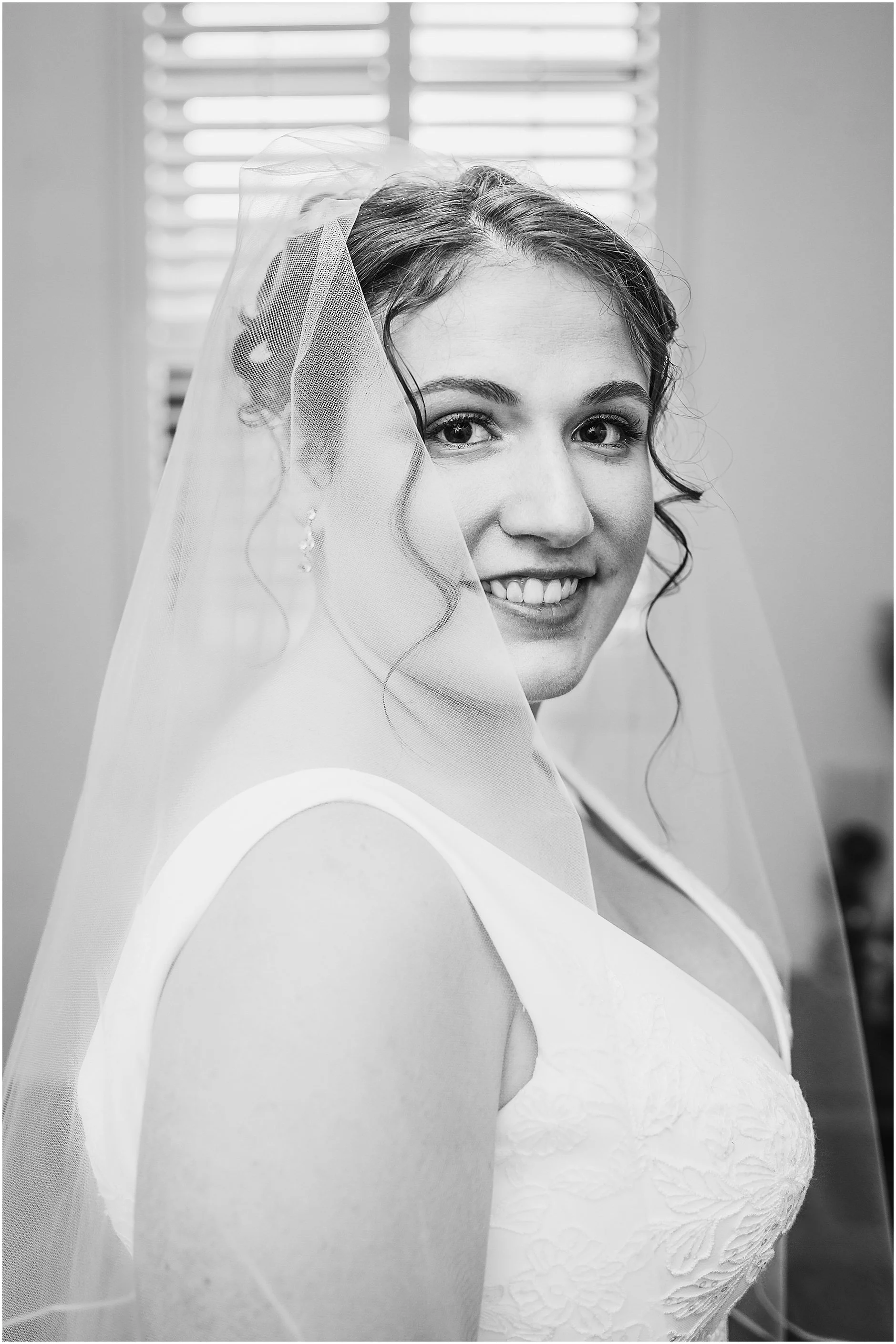 Black and white portrait and Upstate New York bride as she gets ready to walk down the aisle.