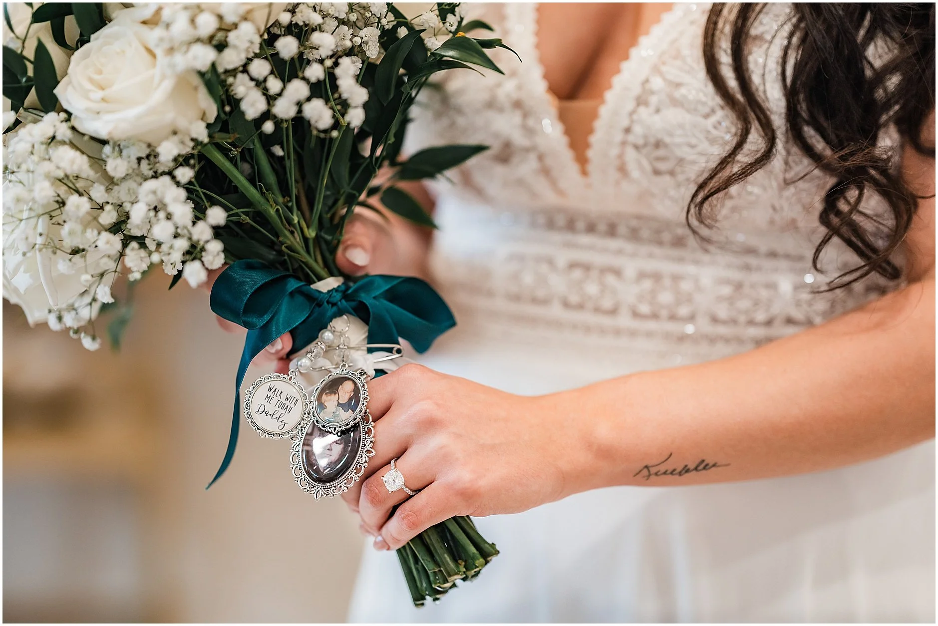 Close up image of pins showing bride's dad on her flower bouquet