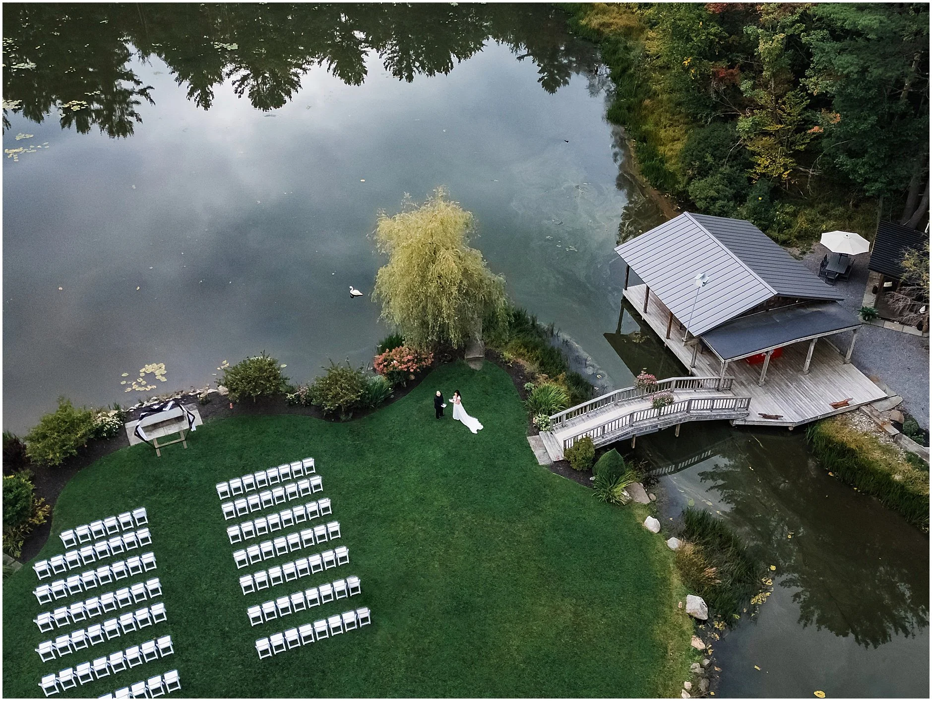 Aerial image captured by a drone showing the grounds of The Rosemary at Spano Lake and bride and groom sharing private vows