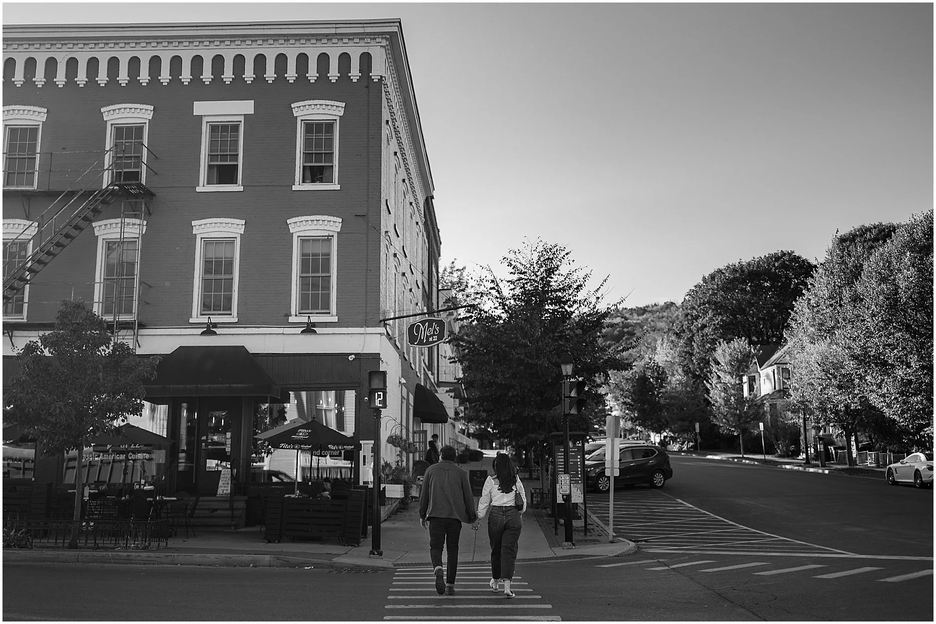 Engagement photo outside Mel’s 22 in downtown Cooperstown NY