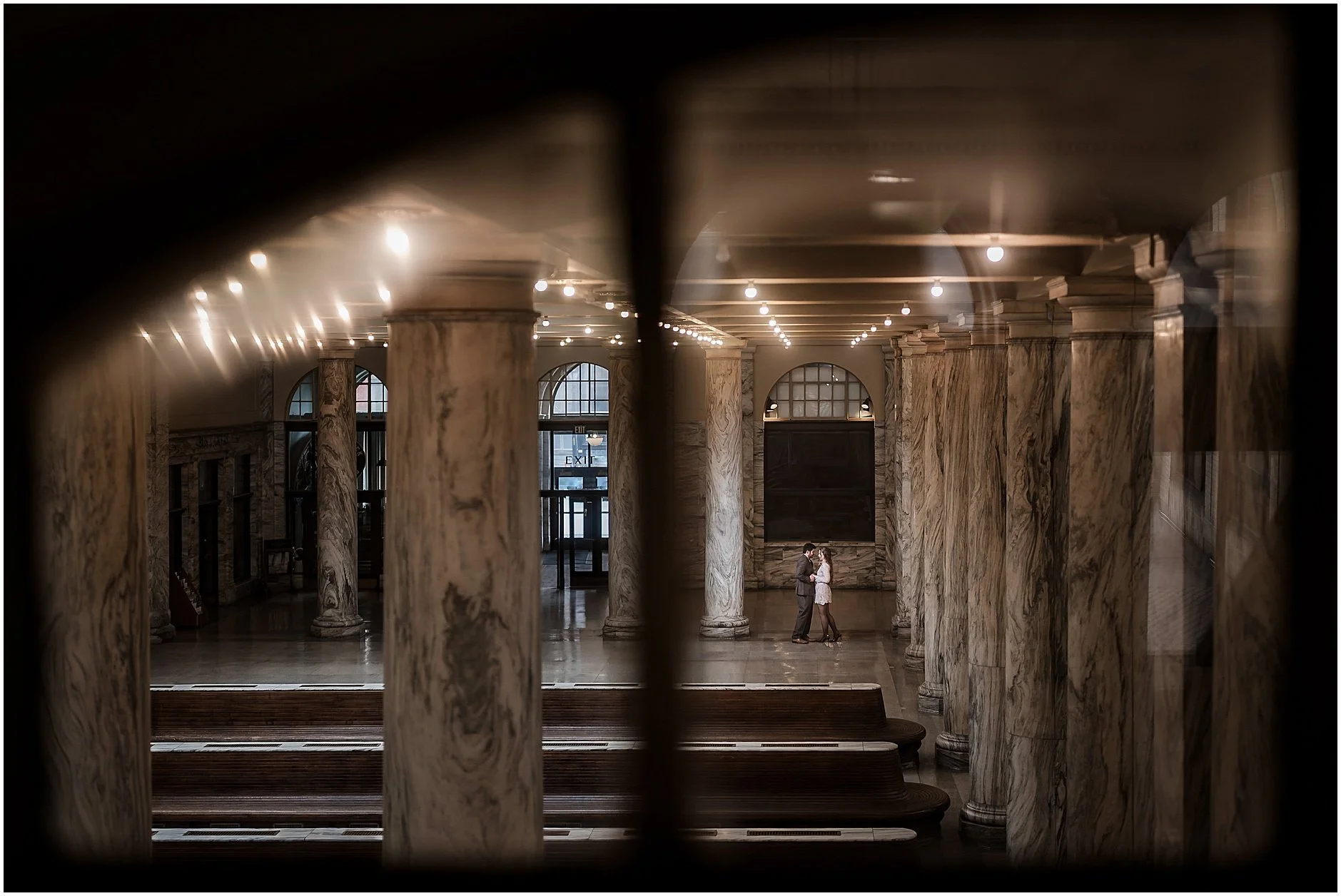 Romantic engagement portraits of a couple at a historic train station in Upstate New York during spring.