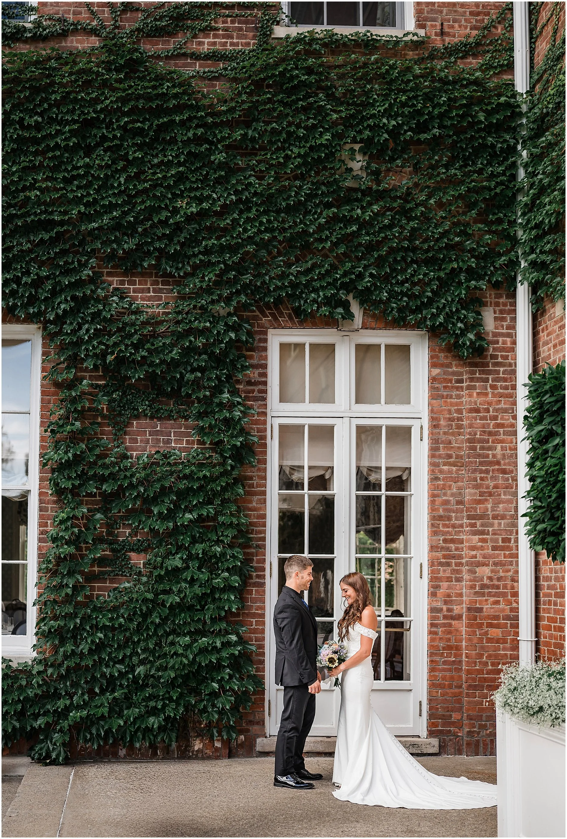 Bride and groom laughing together during their intimate Cooperstown elopement.